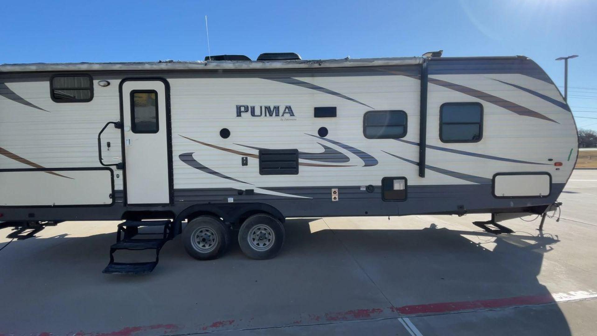 2017 PUMA XLITE28FQDB (4X4TPUD22HP) , Length: 33 ft | Dry Weight: 6,370 lbs | Gross Weight: 8,000 lbs | Slides: 1 transmission, located at 4319 N Main St, Cleburne, TX, 76033, (817) 678-5133, 32.385960, -97.391212 - The 2017 Puma 28FQDB travel trailer is ideal for family excursions. With a length of 33 feet and a dry weight of 6,370 pounds, this RV is both large and lightweight, making it simple to tow and navigate on the road. With an outdoor kitchen and a large 20-foot motorized awning, you can enjoy outdoor - Photo#2