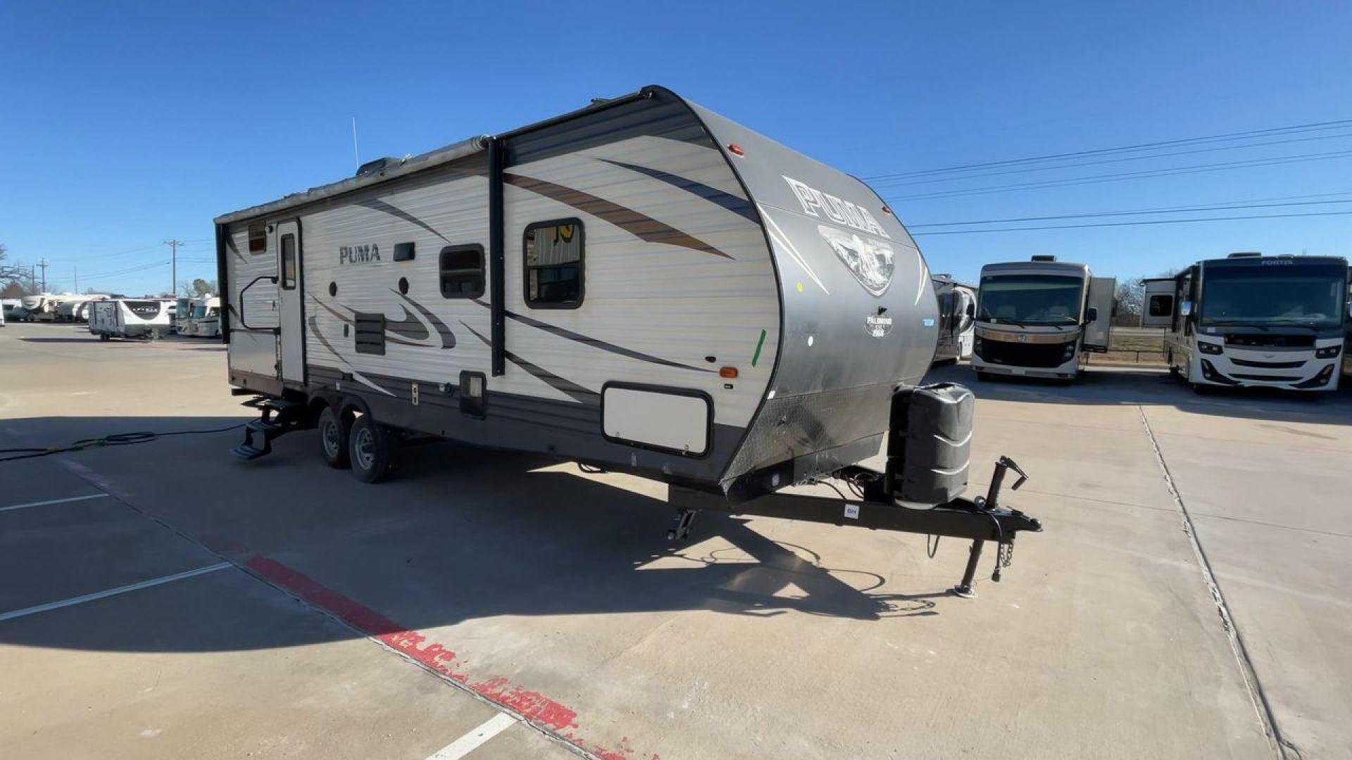 2017 PUMA XLITE28FQDB (4X4TPUD22HP) , Length: 33 ft | Dry Weight: 6,370 lbs | Gross Weight: 8,000 lbs | Slides: 1 transmission, located at 4319 N Main St, Cleburne, TX, 76033, (817) 678-5133, 32.385960, -97.391212 - The 2017 Puma 28FQDB travel trailer is ideal for family excursions. With a length of 33 feet and a dry weight of 6,370 pounds, this RV is both large and lightweight, making it simple to tow and navigate on the road. With an outdoor kitchen and a large 20-foot motorized awning, you can enjoy outdoor - Photo#3