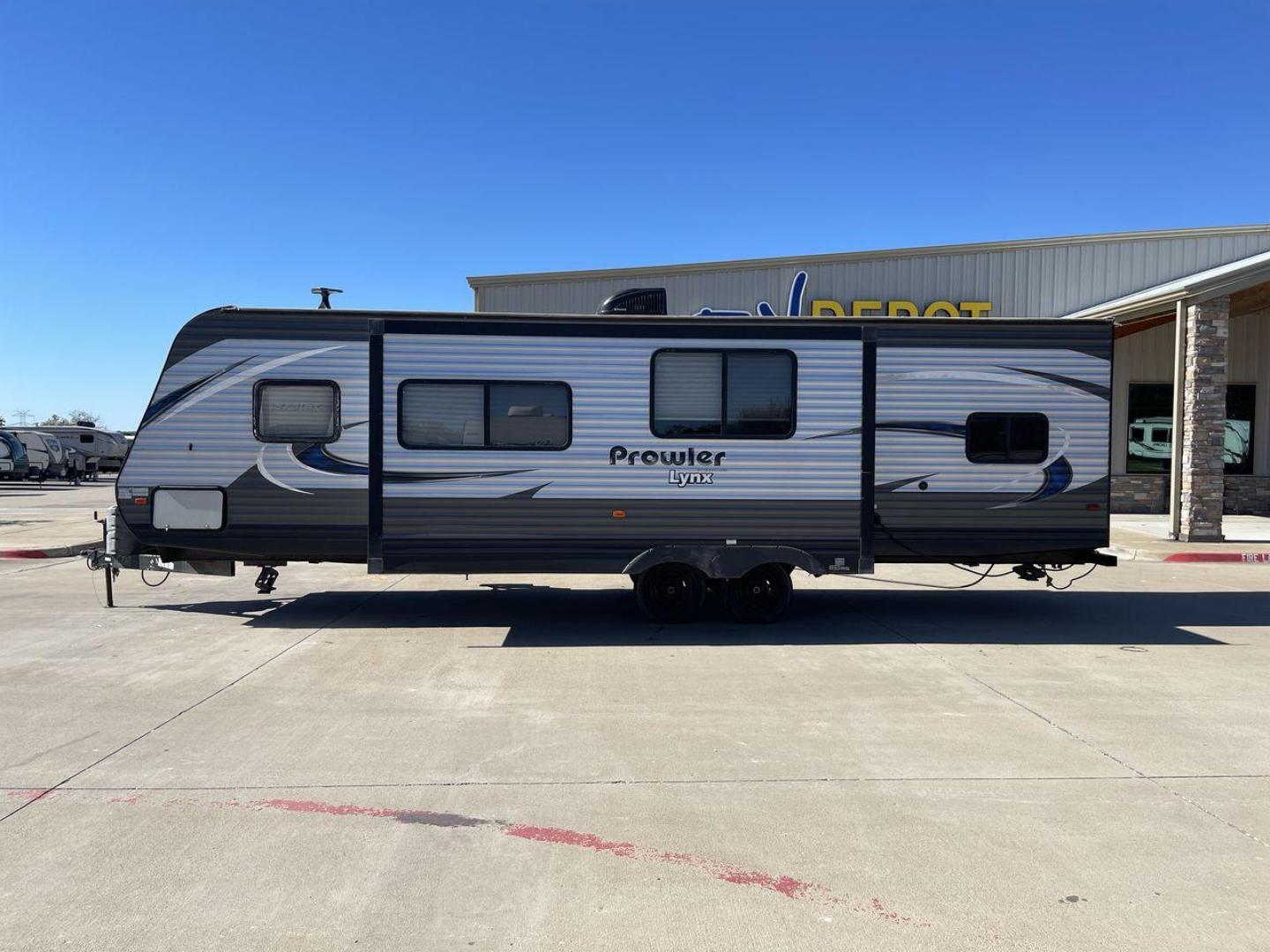 2018 HEARTLAND PROWLER (5SFPB3326JE) , Length: 33.92 ft. | Dry Weight: 6,720 lbs. | Gross Weight: 9,000 lbs. | Slides: 1 transmission, located at 4319 N Main St, Cleburne, TX, 76033, (817) 678-5133, 32.385960, -97.391212 - This 2018 Prowler 30LX travel trailer measures 33'11" feet. It is a dual axle, steel wheel setup with electric drum brakes. Its dry weight is 6,720 lbs, its payload capacity 2,130 lbs, its hitch weight 880 lbs, and the GVWR 9,000 lbs. The fiberglass exterior is painted gray with blue and white graph - Photo#22