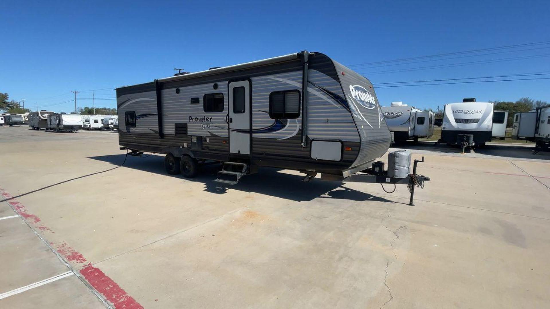 2018 HEARTLAND PROWLER (5SFPB3326JE) , Length: 33.92 ft. | Dry Weight: 6,720 lbs. | Gross Weight: 9,000 lbs. | Slides: 1 transmission, located at 4319 N Main St, Cleburne, TX, 76033, (817) 678-5133, 32.385960, -97.391212 - This 2018 Prowler 30LX travel trailer measures 33'11" feet. It is a dual axle, steel wheel setup with electric drum brakes. Its dry weight is 6,720 lbs, its payload capacity 2,130 lbs, its hitch weight 880 lbs, and the GVWR 9,000 lbs. The fiberglass exterior is painted gray with blue and white graph - Photo#3