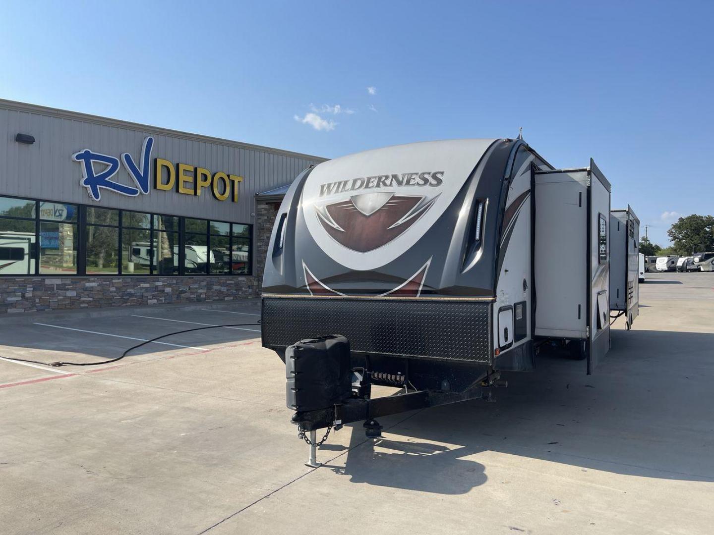 2018 GRAY HEARTLAND WILDERNESS 3375KL (5SFNB3926JE) , Length: 39.67 ft. | Dry Weight: 8,699 lbs. | Gross Weight: 9,600 lbs. | Slides: 3 transmission, located at 4319 N Main St, Cleburne, TX, 76033, (817) 678-5133, 32.385960, -97.391212 - If you're searching for a travel trailer that offers the true comforts of a regular home, this 2018 Heartland Wilderness 3375KL is the one for you! It measures just a bit under 40 ft. in length and weighs 8,699 lbs. unloaded. It has a GVWR of 9,600 lbs. and a hitch weight of 799 lbs. It is sizable y - Photo#0