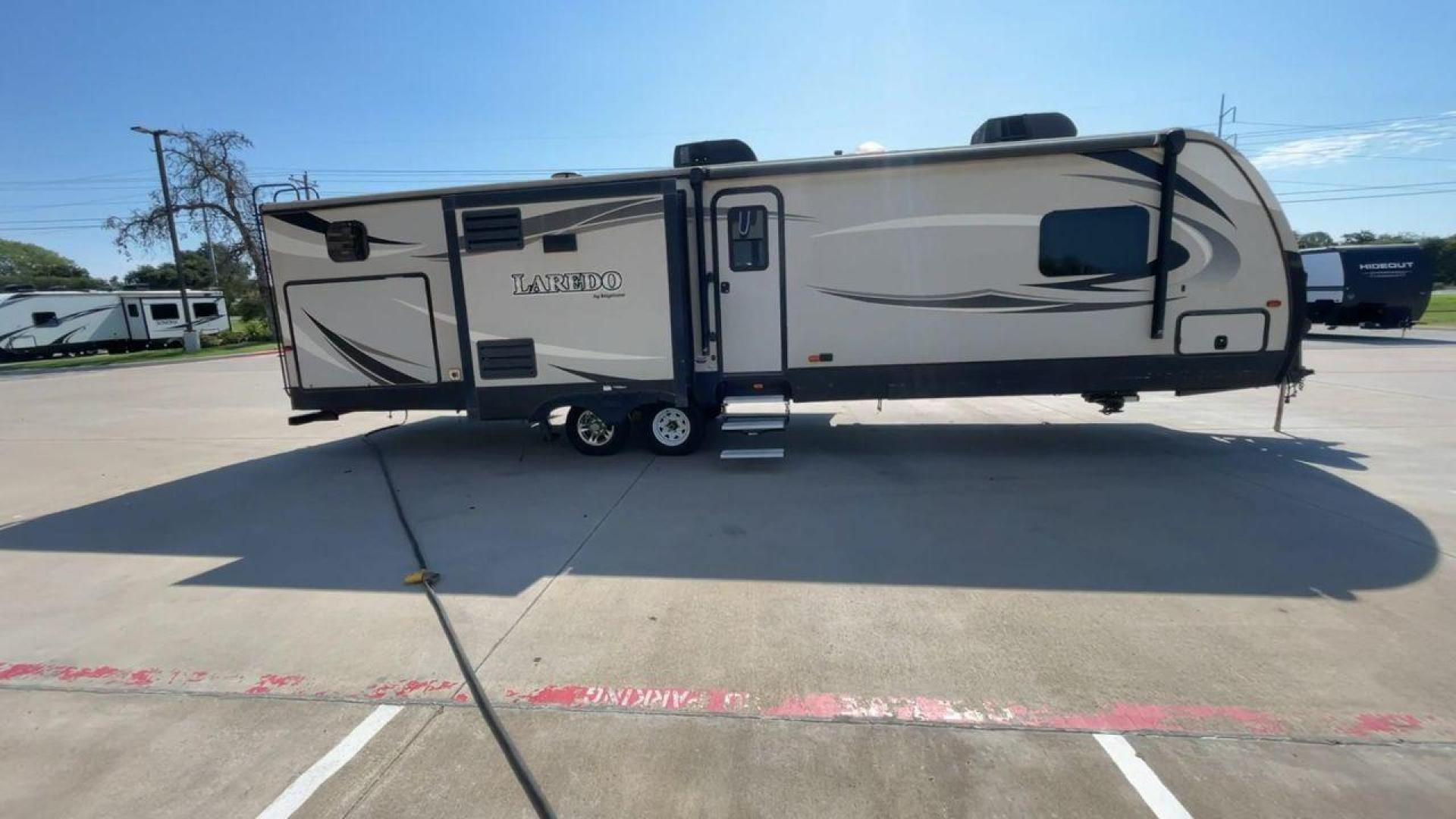 2018 KEYSTONE LAREDO 331BH (4YDT33129JV) , Length: 37.92 ft. | Dry Weight: 8,090 lbs. | Gross Weight: 9,655 lbs. 9,655 lbs. | Slides: 3 transmission, located at 4319 N Main St, Cleburne, TX, 76033, (817) 678-5133, 32.385960, -97.391212 - Photo#2