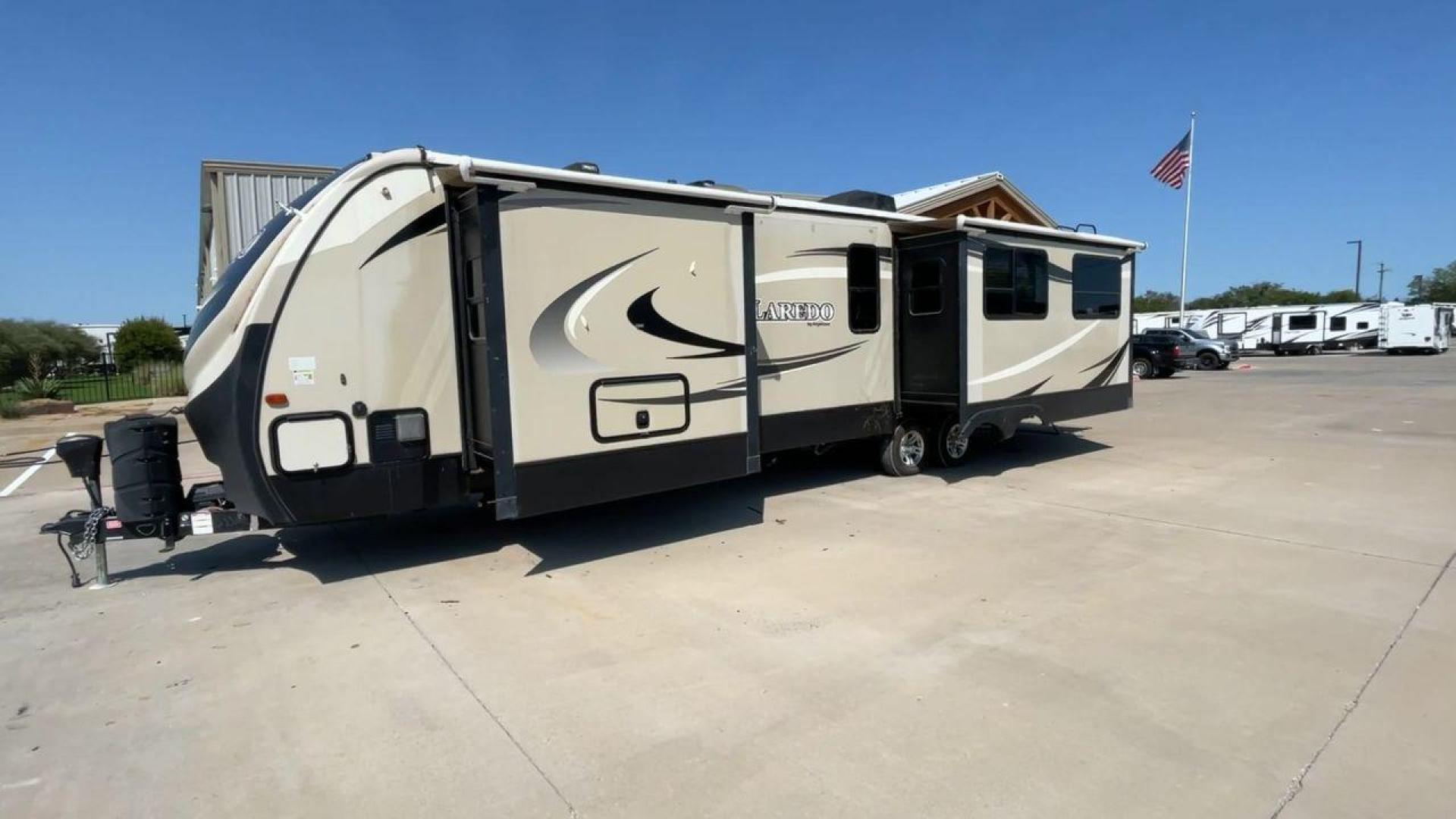 2018 KEYSTONE LAREDO 335MK (4YDT33524JV) , Length: 37.92 ft. | Dry Weight: 8,473 lbs. | Gross Weight: 10,000 lbs. | Slides: 2 transmission, located at 4319 N Main St, Cleburne, TX, 76033, (817) 678-5133, 32.385960, -97.391212 - The 2018 Keystone Laredo 335MK is a spacious and feature-packed travel trailer with a length of 37.92 ft, a dry weight of 8,473 lbs, and a gross weight capacity of 10,000 lbs. It includes two large slide-outs, significantly expanding the living and kitchen areas. The exterior features a cream and be - Photo#5