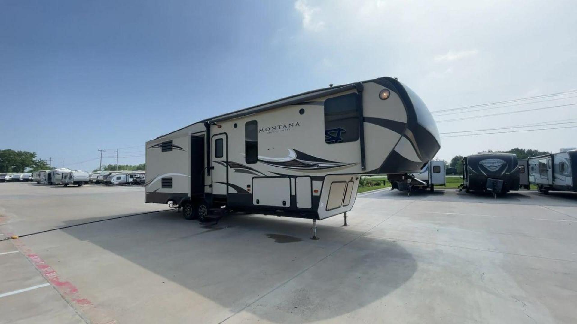 2018 TAN KEYSTONE MONTANA 305RL (4YDF3052XJA) , Length: 35.67 ft. | Dry Weight: 10,390 lbs. | Gross Weight: 14,270 lbs. | Slides: 3 transmission, located at 4319 N Main St, Cleburne, TX, 76033, (817) 678-5133, 32.385960, -97.391212 - The 2018 Keystone Montana 305RL is a dual-axle aluminum wheel set-up that measures 35.67 ft. in length. It has a dry weight of 10,390 lbs. and a GVWR of 14,270 lbs. It is made of aluminum and fiberglass. It comes with automatic heating and cooling rated at 35,000 and 15,000 BTUs respectively. With 3 - Photo#3