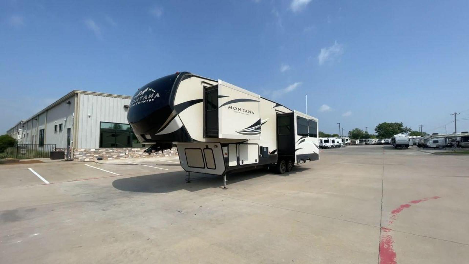 2018 TAN KEYSTONE MONTANA 305RL (4YDF3052XJA) , Length: 35.67 ft. | Dry Weight: 10,390 lbs. | Gross Weight: 14,270 lbs. | Slides: 3 transmission, located at 4319 N Main St, Cleburne, TX, 76033, (817) 678-5133, 32.385960, -97.391212 - The 2018 Keystone Montana 305RL is a dual-axle aluminum wheel set-up that measures 35.67 ft. in length. It has a dry weight of 10,390 lbs. and a GVWR of 14,270 lbs. It is made of aluminum and fiberglass. It comes with automatic heating and cooling rated at 35,000 and 15,000 BTUs respectively. With 3 - Photo#5