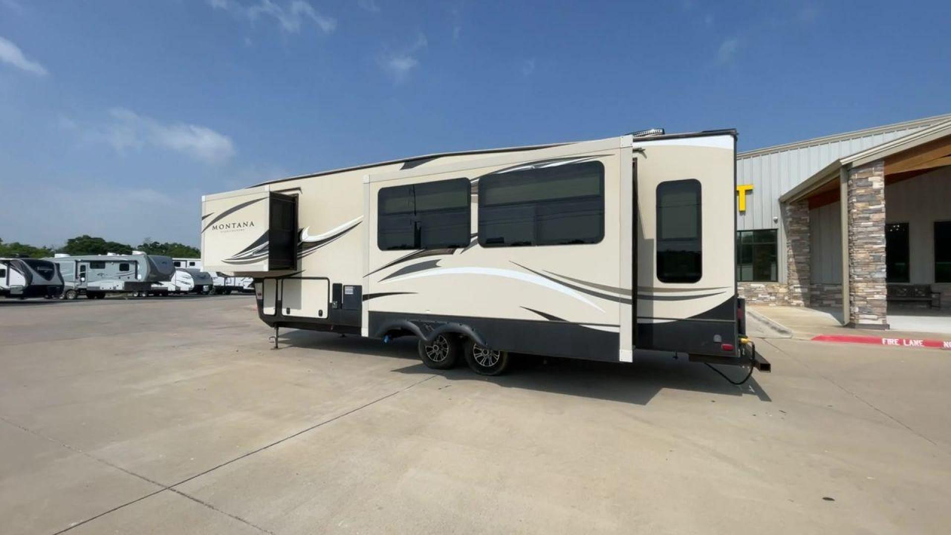 2018 TAN KEYSTONE MONTANA 305RL (4YDF3052XJA) , Length: 35.67 ft. | Dry Weight: 10,390 lbs. | Gross Weight: 14,270 lbs. | Slides: 3 transmission, located at 4319 N Main St, Cleburne, TX, 76033, (817) 678-5133, 32.385960, -97.391212 - The 2018 Keystone Montana 305RL is a dual-axle aluminum wheel set-up that measures 35.67 ft. in length. It has a dry weight of 10,390 lbs. and a GVWR of 14,270 lbs. It is made of aluminum and fiberglass. It comes with automatic heating and cooling rated at 35,000 and 15,000 BTUs respectively. With 3 - Photo#7