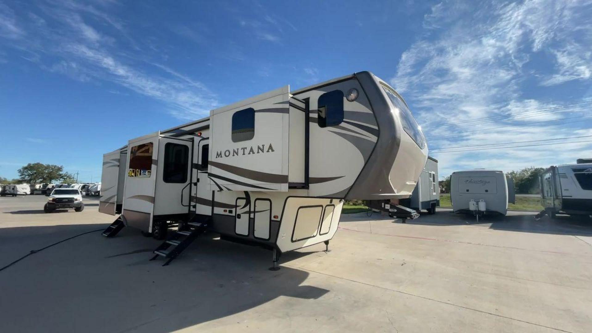 2018 WHITE KEYSTONE MONTANA 3820FK (4YDF38226J4) , Length: 40.75 ft. | Dry Weight: 13,895 lbs. | Gross Weight: 16,810 lbs. | Slides: 5 transmission, located at 4319 N Main St, Cleburne, TX, 76033, (817) 678-5133, 32.385960, -97.391212 - The 2018 Keystone Montana 3820FK Fifth Wheel is the definition of opulence and ingenuity in the realm of RVs. Spanning an impressive ~41 feet, this extraordinary fifth wheel introduces a distinctive front kitchen layout that sets it apart in terms of expansive living. The cutting-edge elevated kitch - Photo#1