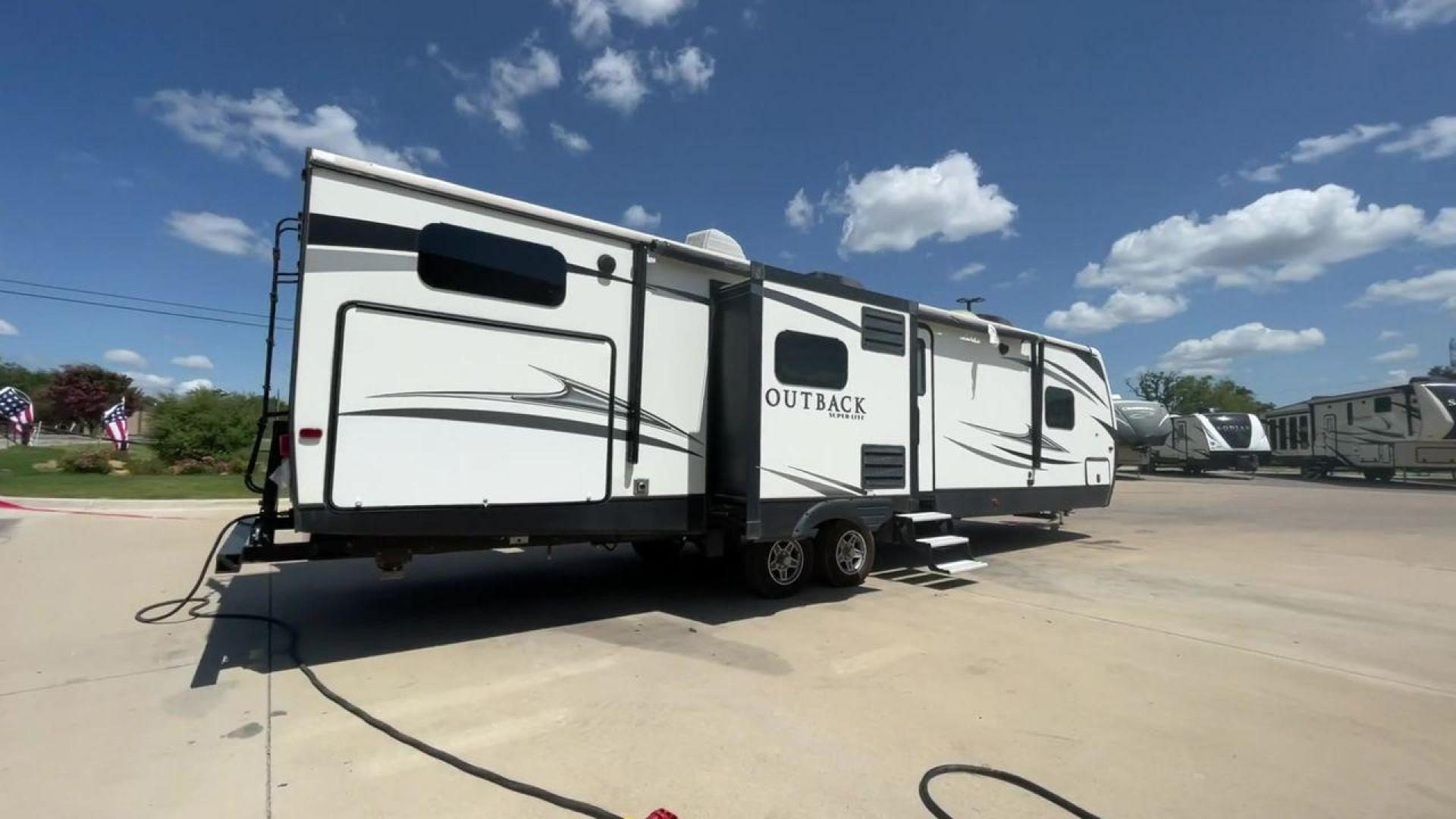 2018 BLACK KEYSTONE RV OUTBACK 325BH (4YDT32520JB) , Length: 37.42 ft. | Dry Weight: 8,428 lbs. | Gross Weight: 10,500 lbs. | Slides: 3 transmission, located at 4319 N Main St, Cleburne, TX, 76033, (817) 678-5133, 32.385960, -97.391212 - With the 2018 Keystone RV Outback 325BH Travel Trailer, unleash your spirit of adventure. Designed to provide families or groups with a roomy and cozy home on wheels, this travel trailer blends contemporary conveniences with tough durability to create a remarkable travel experience. The dimension - Photo#1