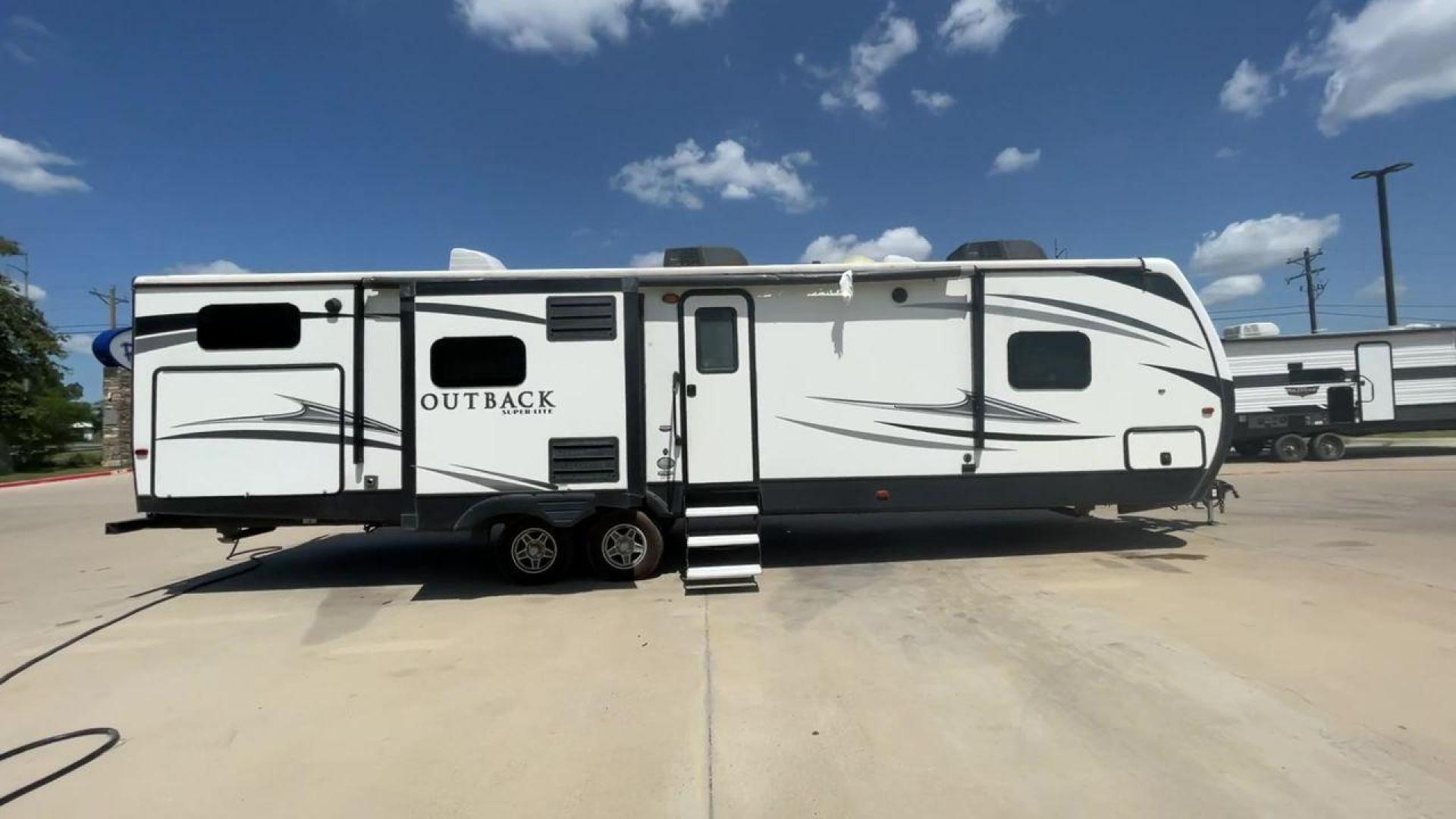 2018 BLACK KEYSTONE RV OUTBACK 325BH (4YDT32520JB) , Length: 37.42 ft. | Dry Weight: 8,428 lbs. | Gross Weight: 10,500 lbs. | Slides: 3 transmission, located at 4319 N Main St, Cleburne, TX, 76033, (817) 678-5133, 32.385960, -97.391212 - With the 2018 Keystone RV Outback 325BH Travel Trailer, unleash your spirit of adventure. Designed to provide families or groups with a roomy and cozy home on wheels, this travel trailer blends contemporary conveniences with tough durability to create a remarkable travel experience. The dimension - Photo#2