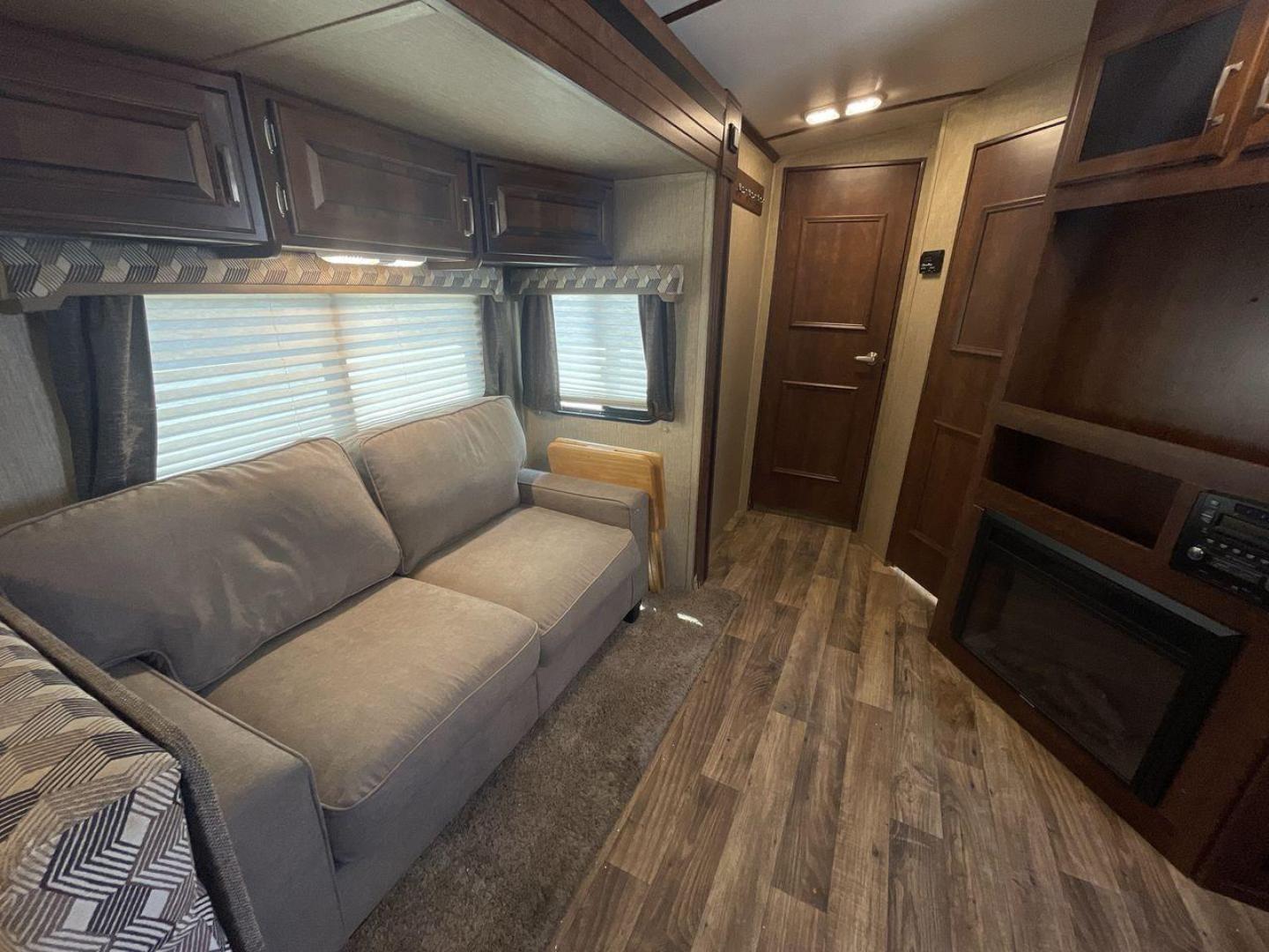 2018 BLACK KEYSTONE RV OUTBACK 325BH (4YDT32520JB) , Length: 37.42 ft. | Dry Weight: 8,428 lbs. | Gross Weight: 10,500 lbs. | Slides: 3 transmission, located at 4319 N Main St, Cleburne, TX, 76033, (817) 678-5133, 32.385960, -97.391212 - With the 2018 Keystone RV Outback 325BH Travel Trailer, unleash your spirit of adventure. Designed to provide families or groups with a roomy and cozy home on wheels, this travel trailer blends contemporary conveniences with tough durability to create a remarkable travel experience. The dimension - Photo#11