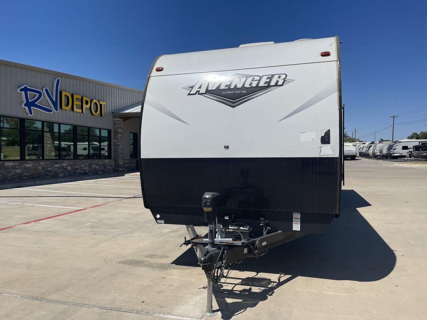 2019 TAN FOREST RIVER AVENGER 32DEN (5ZT2AVXB6KB) , Length: 37.92 ft. | Dry Weight: 7,989 lbs. | Slides: 2 transmission, located at 4319 N Main St, Cleburne, TX, 76033, (817) 678-5133, 32.385960, -97.391212 - Measuring an impressive 36 feet, this model unfolds to reveal two strategically placed slide-outs, creating a spacious haven for relaxation. The master bedroom welcomes you with a queen-size bed and ample storage, ensuring a peaceful retreat after a day of outdoor exploration. The living area is a h - Photo#0