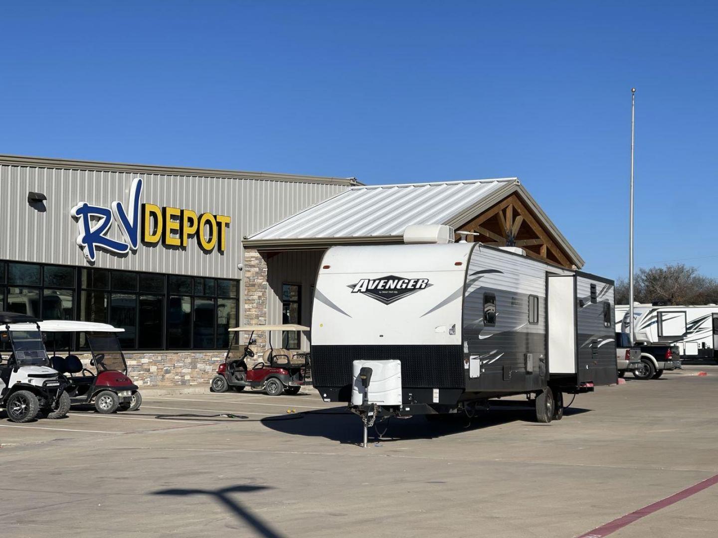 2019 TAN FOREST RIVER AVENGER 32DEN (5ZT2AVXB6KB) , Length: 37.92 ft. | Dry Weight: 7,989 lbs. | Slides: 2 transmission, located at 4319 N Main St, Cleburne, TX, 76033, (817) 678-5133, 32.385960, -97.391212 - Measuring an impressive 36 feet, this model unfolds to reveal two strategically placed slide-outs, creating a spacious haven for relaxation. The master bedroom welcomes you with a queen-size bed and ample storage, ensuring a peaceful retreat after a day of outdoor exploration. The living area is a h - Photo#0