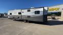 2019 TAN FOREST RIVER AVENGER 32DEN (5ZT2AVXB6KB) , Length: 37.92 ft. | Dry Weight: 7,989 lbs. | Slides: 2 transmission, located at 4319 N Main St, Cleburne, TX, 76033, (817) 678-5133, 32.385960, -97.391212 - Measuring an impressive 36 feet, this model unfolds to reveal two strategically placed slide-outs, creating a spacious haven for relaxation. The master bedroom welcomes you with a queen-size bed and ample storage, ensuring a peaceful retreat after a day of outdoor exploration. The living area is a h - Photo#7