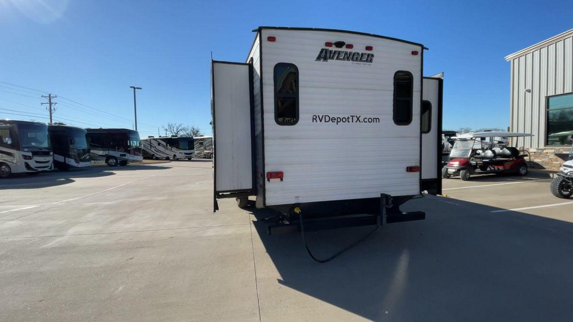 2019 TAN FOREST RIVER AVENGER 32DEN (5ZT2AVXB6KB) , Length: 37.92 ft. | Dry Weight: 7,989 lbs. | Slides: 2 transmission, located at 4319 N Main St, Cleburne, TX, 76033, (817) 678-5133, 32.385960, -97.391212 - Measuring an impressive 36 feet, this model unfolds to reveal two strategically placed slide-outs, creating a spacious haven for relaxation. The master bedroom welcomes you with a queen-size bed and ample storage, ensuring a peaceful retreat after a day of outdoor exploration. The living area is a h - Photo#8