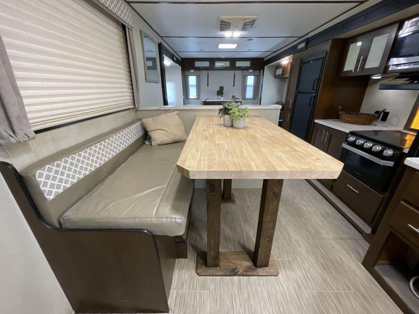 2019 TAN FOREST RIVER AVENGER 32DEN (5ZT2AVXB6KB) , Length: 37.92 ft. | Dry Weight: 7,989 lbs. | Slides: 2 transmission, located at 4319 N Main St, Cleburne, TX, 76033, (817) 678-5133, 32.385960, -97.391212 - Measuring an impressive 36 feet, this model unfolds to reveal two strategically placed slide-outs, creating a spacious haven for relaxation. The master bedroom welcomes you with a queen-size bed and ample storage, ensuring a peaceful retreat after a day of outdoor exploration. The living area is a h - Photo#14