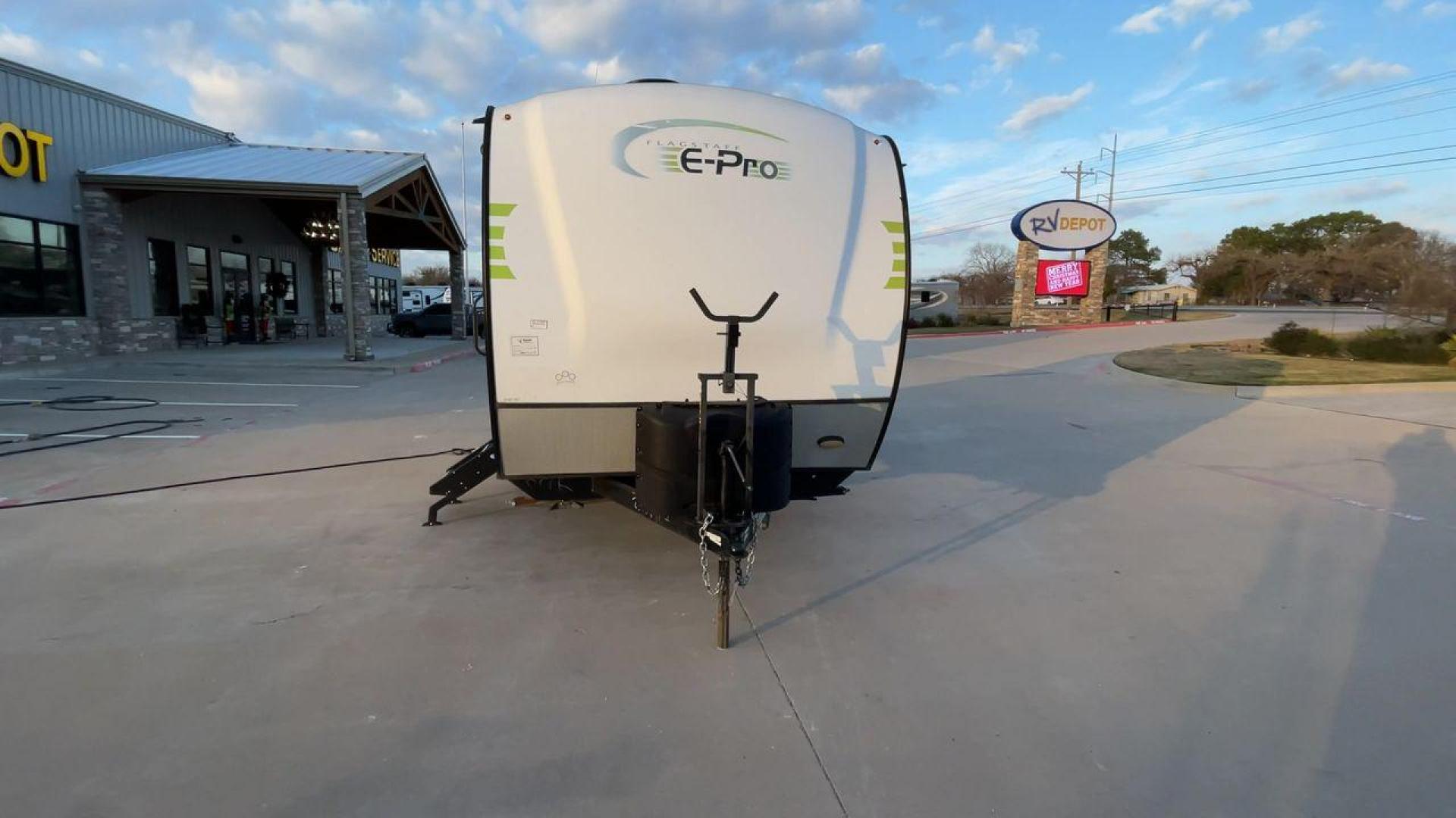 2019 FOREST RIVER FLAGSTAFF E-PRO 16BH (5ZT2FSEC3K3) , Length: 18.33 ft. | Dry Weight: 2,993 lbs. | Slides: 1 transmission, located at 4319 N Main St, Cleburne, TX, 76033, (817) 678-5133, 32.385960, -97.391212 - The 2019 Forest River Flagstaff E-Pro 16BH is a compact, lightweight travel trailer designed for adventure. Its exterior features a sleek and modern design with a white body accented by bold green graphics, giving it a fresh and sporty look. The single slide-out on the driver's side provides additio - Photo#4