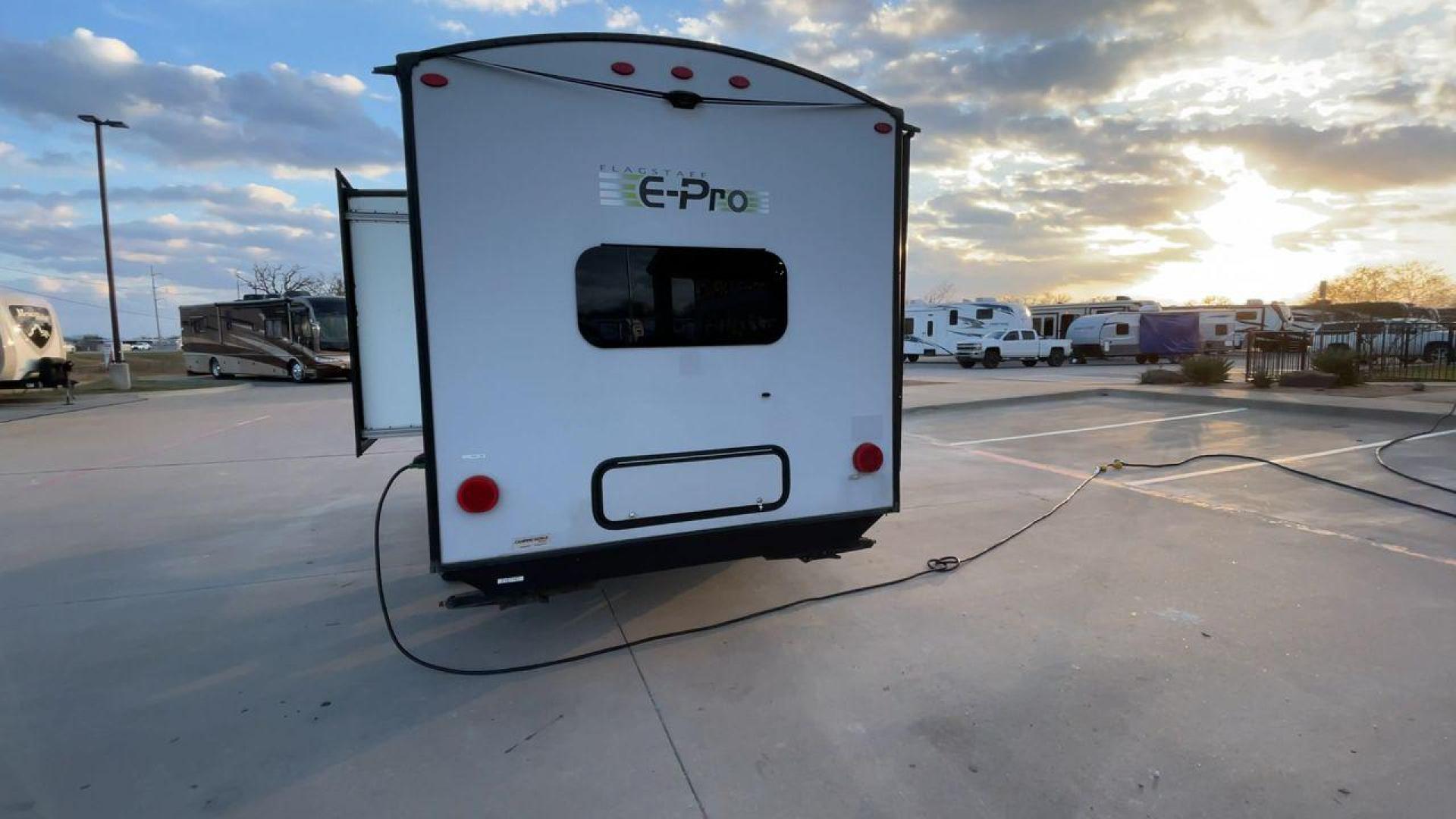 2019 FOREST RIVER FLAGSTAFF E-PRO 16BH (5ZT2FSEC3K3) , Length: 18.33 ft. | Dry Weight: 2,993 lbs. | Slides: 1 transmission, located at 4319 N Main St, Cleburne, TX, 76033, (817) 678-5133, 32.385960, -97.391212 - The 2019 Forest River Flagstaff E-Pro 16BH is a compact, lightweight travel trailer designed for adventure. Its exterior features a sleek and modern design with a white body accented by bold green graphics, giving it a fresh and sporty look. The single slide-out on the driver's side provides additio - Photo#8