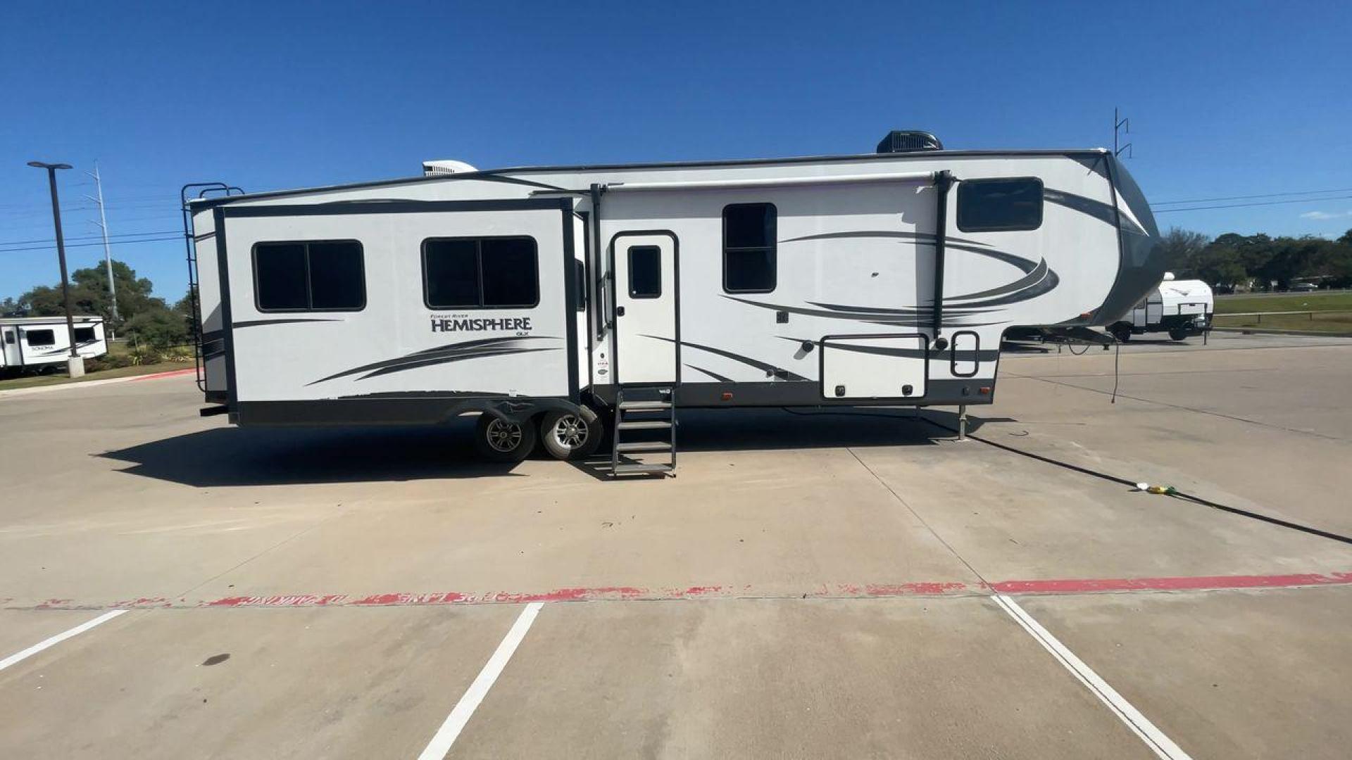 2019 FOREST RIVER HEMISPHERE 337BAR (4X4FSBK25KV) , Length: 38.5 ft. | Dry Weight: 10,264 lbs. | Slides: 3 transmission, located at 4319 N Main St, Cleburne, TX, 76033, (817) 678-5133, 32.385960, -97.391212 - Photo#2