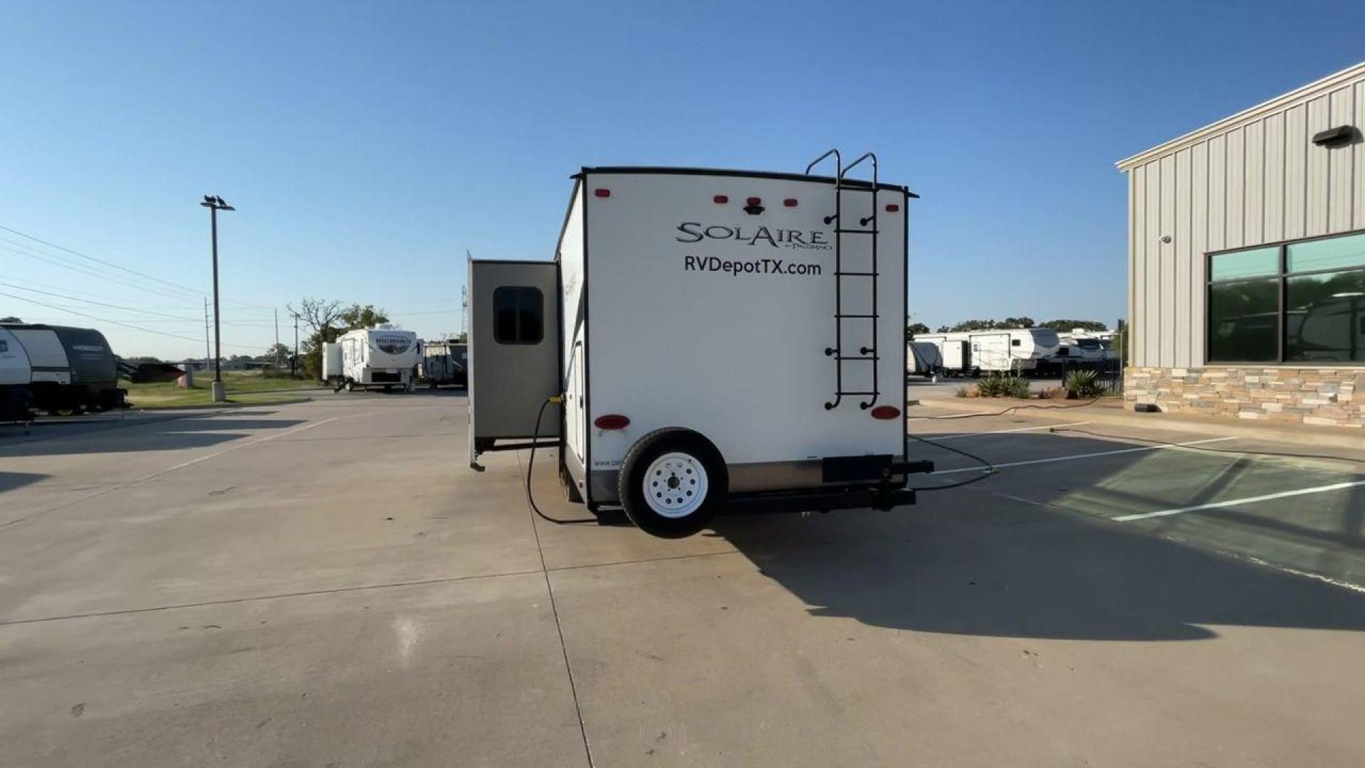 2019 TAN FOREST RIVER SOLAIRE 258RBSS (4X4TPAB24KN) , Length: 32.67 ft. | Dry Weight: 6,398 lbs. | Gross Weight: 7,765 lbs. | Slides: 1 transmission, located at 4319 N Main St, Cleburne, TX, 76033, (817) 678-5133, 32.385960, -97.391212 - The 2019 Palomino Solaire 258RBSS Travel Trailer combines style with functionality. Measuring 32.67 feet in length, this unit features a single slide-out, which provides additional interior space. The white and gray body is accented with dynamic graphics, offering a contemporary look. The front show - Photo#8