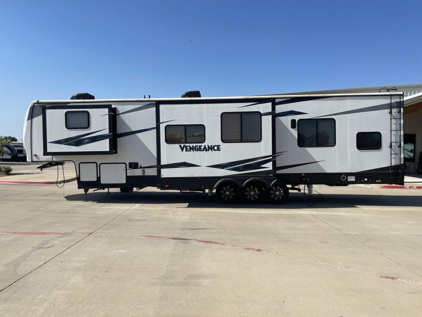 2019 FOREST RIVER VENGEANCE 377V (5ZT3VG3F1K6) , Length: 42.33 ft. | Dry Weight: 13,275 lbs. | Gross Weight: 18,000 lbs. | Slides: 3 transmission, located at 4319 N Main St, Cleburne, TX, 76033, (817) 678-5133, 32.385960, -97.391212 - The 2019 Forest River Vengeance 377V is not just a toy hauler, it offers a seamless fusion of luxury, versatility, and the rugged capability to carry your prized toys. The trailer comes with an expansive garage area. With a generous cargo space, you can bring along your ATVs, motorcycles, bicycles, - Photo#20