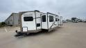 2019 FOREST RIVER WINDJAMMER 3008V (4X4TRLF24K1) , Length: 34 ft | Dry Weight: 7,433 lbs | Slides: 2 transmission, located at 4319 N Main St, Cleburne, TX, 76033, (817) 678-5133, 32.385960, -97.391212 - Measuring 34 ft long, the 2019 Forest River Windjammer 3008V travel trailer is sleek and modern. The body features a white fiberglass surface accented with brown and black decals that provide a stylish and aerodynamic look. The front of the trailer is distinct with its pointed V-nose design. This en - Photo#5