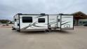 2019 FOREST RIVER WINDJAMMER 3008V (4X4TRLF24K1) , Length: 34 ft | Dry Weight: 7,433 lbs | Slides: 2 transmission, located at 4319 N Main St, Cleburne, TX, 76033, (817) 678-5133, 32.385960, -97.391212 - Measuring 34 ft long, the 2019 Forest River Windjammer 3008V travel trailer is sleek and modern. The body features a white fiberglass surface accented with brown and black decals that provide a stylish and aerodynamic look. The front of the trailer is distinct with its pointed V-nose design. This en - Photo#6