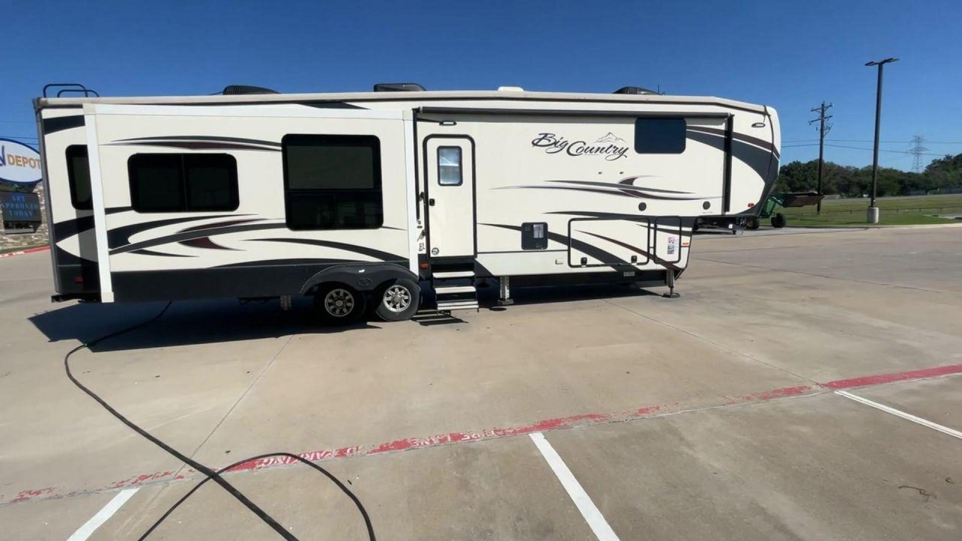 2019 TAN HEARTLAND BIG COUNTRY 3560SS (5SFBG4120KE) , Length: 40.58 ft. | Dry Weight: 13,420 lbs. | Gross Weight: 16,000 lbs. | Slides: 3 transmission, located at 4319 N Main St, Cleburne, TX, 76033, (817) 678-5133, 32.385960, -97.391212 - Photo#2