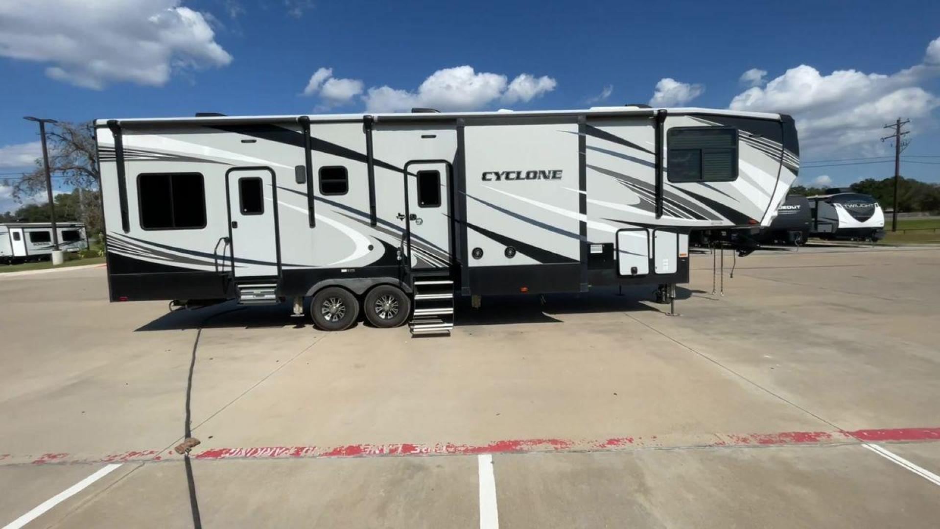 2019 HEARTLAND CYCLONE 3611 (5SFCG3923KE) , Length: 38.8 ft. | Dry Weight: 15,305 lbs. | Gross Weight: 17,000 lbs. | Slides: 3 transmission, located at 4319 N Main St, Cleburne, TX, 76033, (817) 678-5133, 32.385960, -97.391212 - The 2019 Heartland Cyclone 3611 is a high-end toy hauler that combines comfort, versatility, and style, ideal for adventurous families or couples who love to travel with their toys. It measures 38.8 feet in length, making it a spacious option for extended stays or full-time living. It boasts a dry w - Photo#2