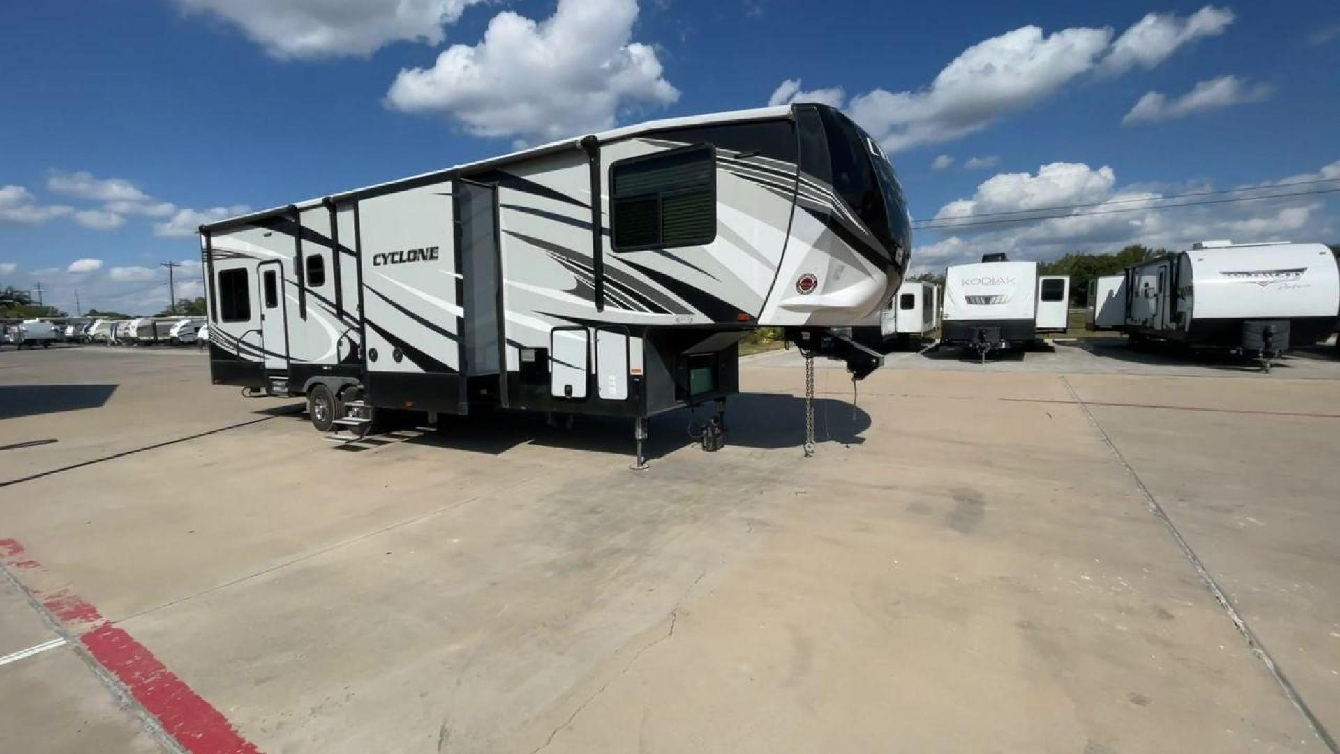 2019 HEARTLAND CYCLONE 3611 (5SFCG3923KE) , Length: 38.8 ft. | Dry Weight: 15,305 lbs. | Gross Weight: 17,000 lbs. | Slides: 3 transmission, located at 4319 N Main St, Cleburne, TX, 76033, (817) 678-5133, 32.385960, -97.391212 - The 2019 Heartland Cyclone 3611 is a high-end toy hauler that combines comfort, versatility, and style, ideal for adventurous families or couples who love to travel with their toys. It measures 38.8 feet in length, making it a spacious option for extended stays or full-time living. It boasts a dry w - Photo#3