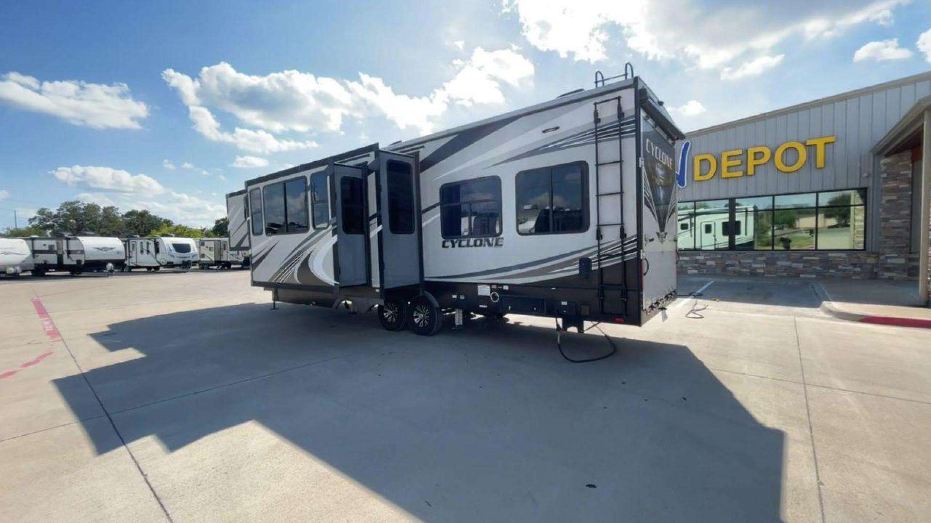 2019 HEARTLAND CYCLONE 3611 (5SFCG3923KE) , Length: 38.8 ft. | Dry Weight: 15,305 lbs. | Gross Weight: 17,000 lbs. | Slides: 3 transmission, located at 4319 N Main St, Cleburne, TX, 76033, (817) 678-5133, 32.385960, -97.391212 - The 2019 Heartland Cyclone 3611 is a high-end toy hauler that combines comfort, versatility, and style, ideal for adventurous families or couples who love to travel with their toys. It measures 38.8 feet in length, making it a spacious option for extended stays or full-time living. It boasts a dry w - Photo#7