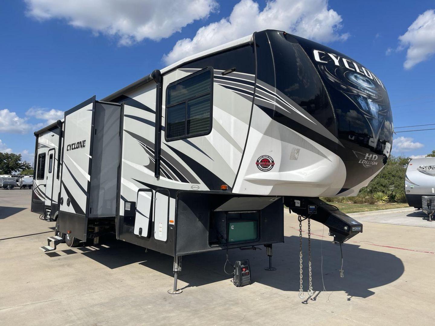 2019 HEARTLAND CYCLONE 3611 (5SFCG3923KE) , Length: 38.8 ft. | Dry Weight: 15,305 lbs. | Gross Weight: 17,000 lbs. | Slides: 3 transmission, located at 4319 N Main St, Cleburne, TX, 76033, (817) 678-5133, 32.385960, -97.391212 - The 2019 Heartland Cyclone 3611 is a high-end toy hauler that combines comfort, versatility, and style, ideal for adventurous families or couples who love to travel with their toys. It measures 38.8 feet in length, making it a spacious option for extended stays or full-time living. It boasts a dry w - Photo#23