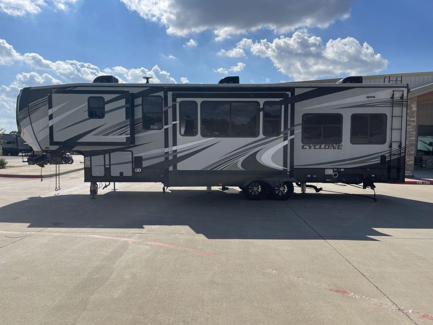 2019 HEARTLAND CYCLONE 3611 (5SFCG3923KE) , Length: 38.8 ft. | Dry Weight: 15,305 lbs. | Gross Weight: 17,000 lbs. | Slides: 3 transmission, located at 4319 N Main St, Cleburne, TX, 76033, (817) 678-5133, 32.385960, -97.391212 - The 2019 Heartland Cyclone 3611 is a high-end toy hauler that combines comfort, versatility, and style, ideal for adventurous families or couples who love to travel with their toys. It measures 38.8 feet in length, making it a spacious option for extended stays or full-time living. It boasts a dry w - Photo#24