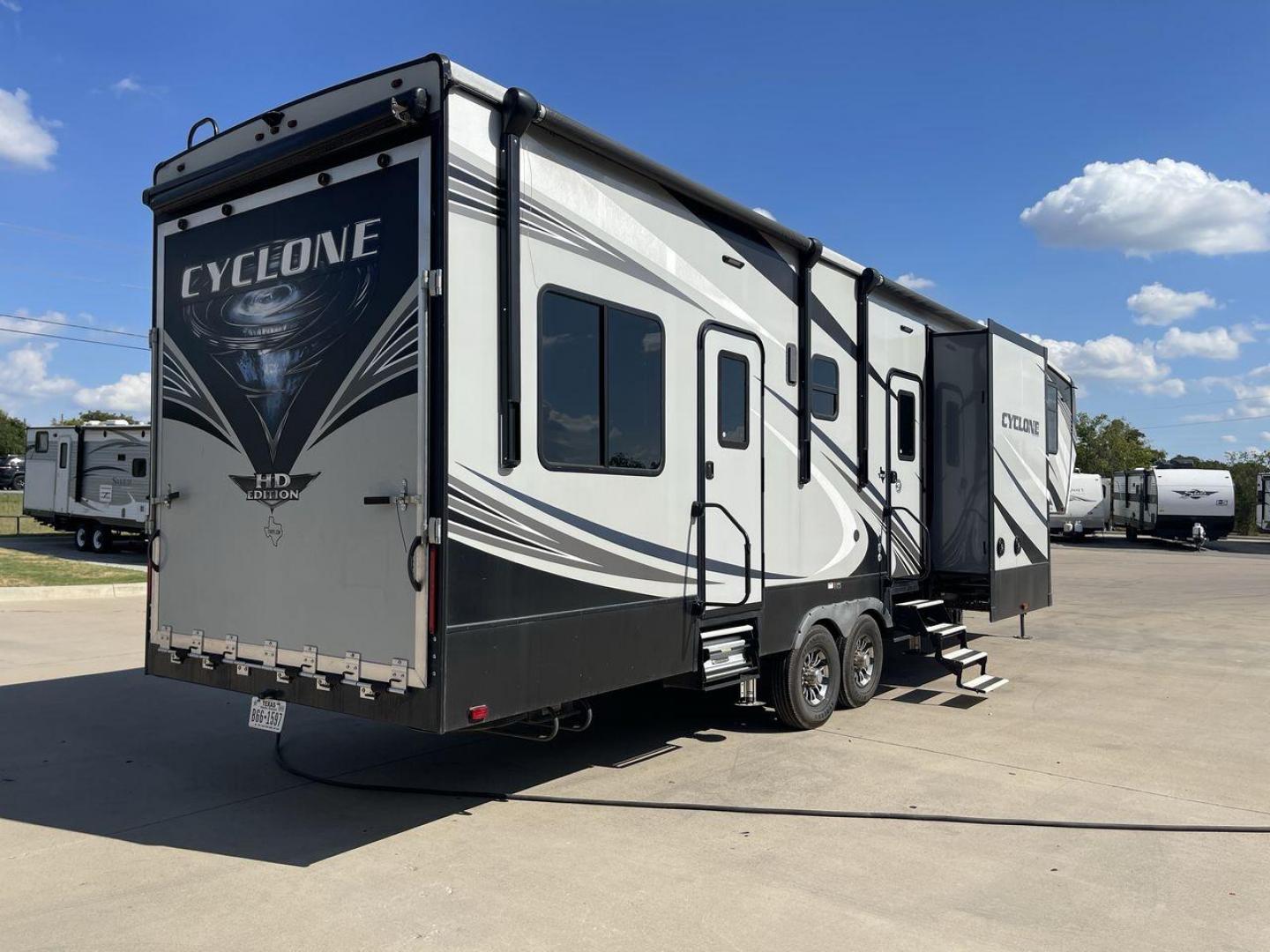 2019 HEARTLAND CYCLONE 3611 (5SFCG3923KE) , Length: 38.8 ft. | Dry Weight: 15,305 lbs. | Gross Weight: 17,000 lbs. | Slides: 3 transmission, located at 4319 N Main St, Cleburne, TX, 76033, (817) 678-5133, 32.385960, -97.391212 - The 2019 Heartland Cyclone 3611 is a high-end toy hauler that combines comfort, versatility, and style, ideal for adventurous families or couples who love to travel with their toys. It measures 38.8 feet in length, making it a spacious option for extended stays or full-time living. It boasts a dry w - Photo#25