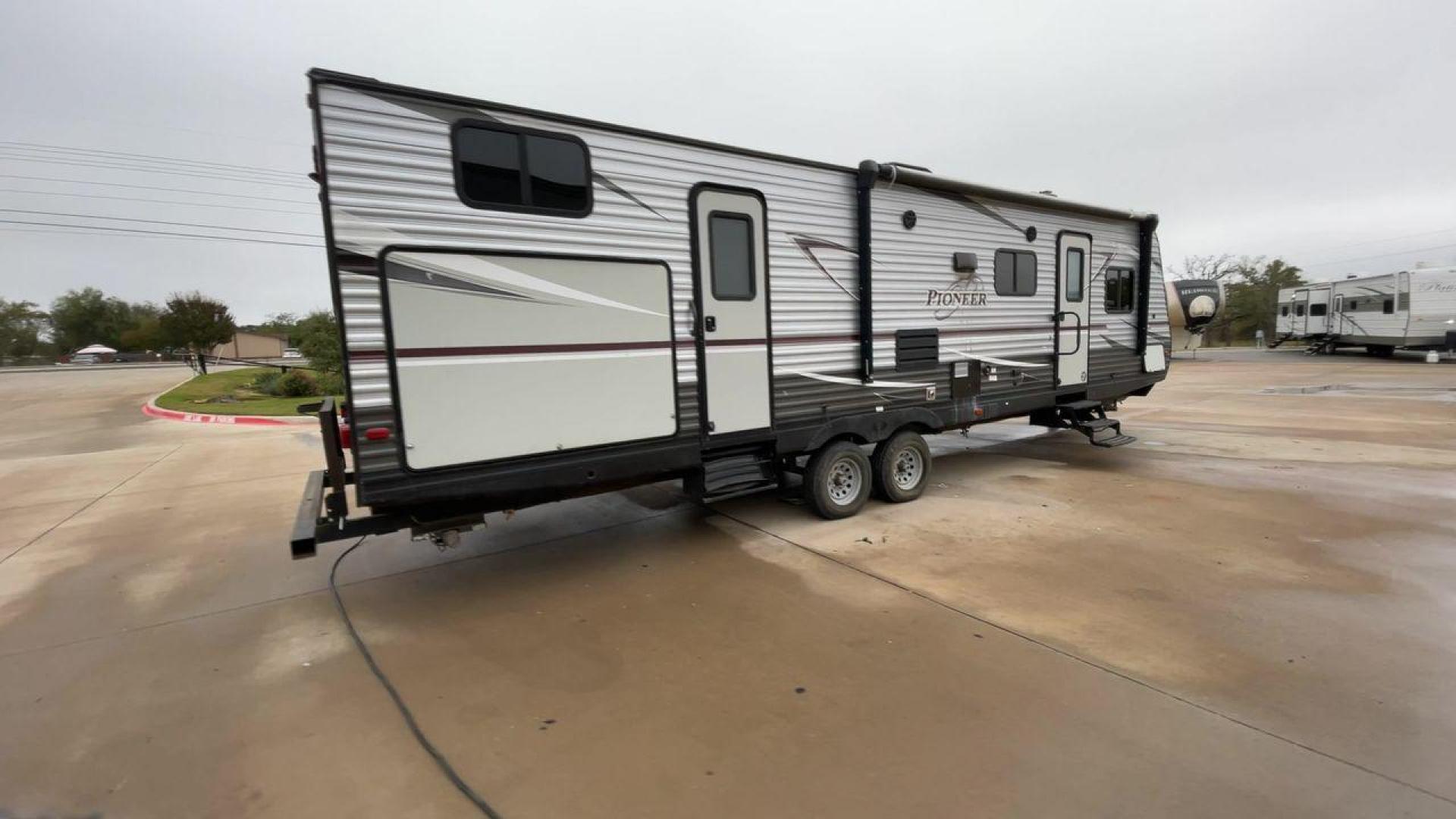 2019 GRAY HEARTLAND PIONEER DS320 (5SFPB3723KE) , Length: 37 ft. | Dry Weight: 7,612 lbs. | Slides: 2 transmission, located at 4319 N Main St, Cleburne, TX, 76033, (817) 678-5133, 32.385960, -97.391212 - The 2019 Heartland Pioneer DS320 is designed to provide comfort and practicality for adventurers. Measuring 37 feet in length, this RV offers ample space for families or groups. Its dry weight of 7,612 lbs makes it towable by a variety of vehicles while maintaining stability on the road. This unit f - Photo#1