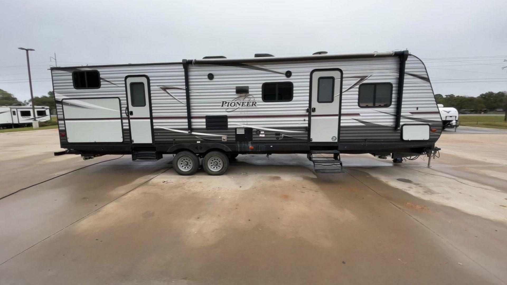 2019 GRAY HEARTLAND PIONEER DS320 (5SFPB3723KE) , Length: 37 ft. | Dry Weight: 7,612 lbs. | Slides: 2 transmission, located at 4319 N Main St, Cleburne, TX, 76033, (817) 678-5133, 32.385960, -97.391212 - The 2019 Heartland Pioneer DS320 is designed to provide comfort and practicality for adventurers. Measuring 37 feet in length, this RV offers ample space for families or groups. Its dry weight of 7,612 lbs makes it towable by a variety of vehicles while maintaining stability on the road. This unit f - Photo#2