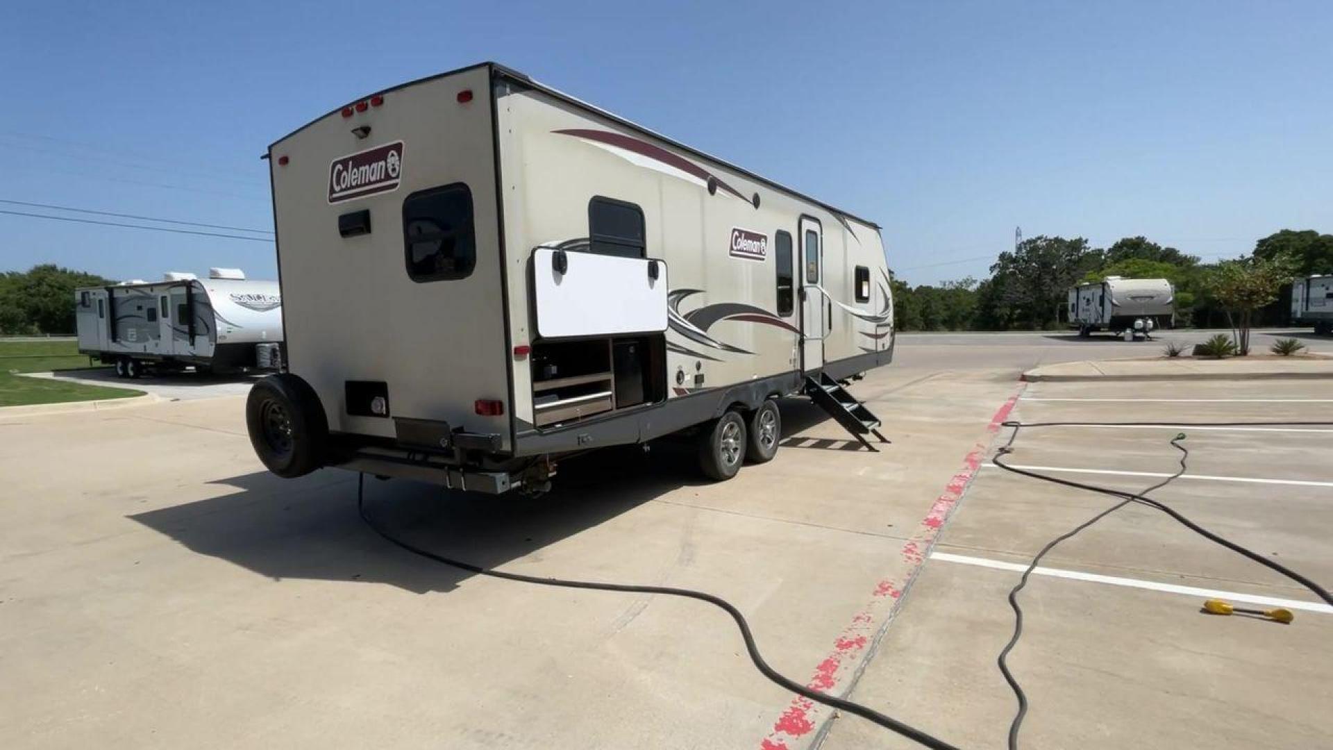 2019 KEYSTONE COLEMAN 2825RK (4YDT28226KM) , Length: 32.92 ft. | Dry Weight: 6,522 lbs. | Slides: 1 transmission, located at 4319 N Main St, Cleburne, TX, 76033, (817) 678-5133, 32.385960, -97.391212 - The 2019 Keystone Coleman 2825RK is intended for comfort and convenience. It measures 32.92 feet long and weighs 6,522 pounds dry. It has a single slide-out that greatly increases the inside room. The outside, streamlined with a clean, neutral color palette highlighted with red and black graphics, p - Photo#1