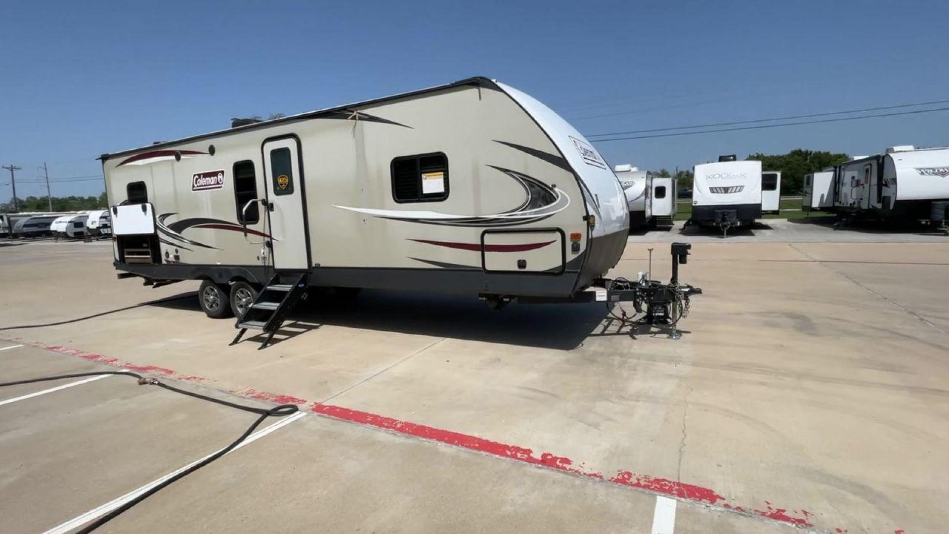 2019 KEYSTONE COLEMAN 2825RK (4YDT28226KM) , Length: 32.92 ft. | Dry Weight: 6,522 lbs. | Slides: 1 transmission, located at 4319 N Main St, Cleburne, TX, 76033, (817) 678-5133, 32.385960, -97.391212 - The 2019 Keystone Coleman 2825RK is intended for comfort and convenience. It measures 32.92 feet long and weighs 6,522 pounds dry. It has a single slide-out that greatly increases the inside room. The outside, streamlined with a clean, neutral color palette highlighted with red and black graphics, p - Photo#3