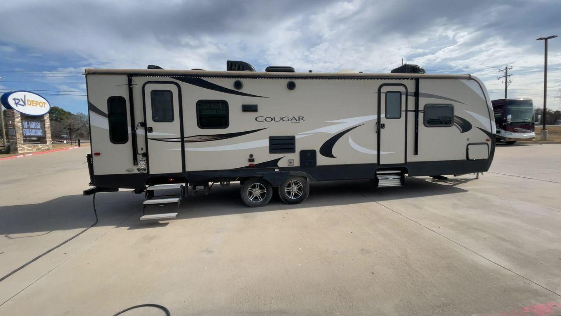 2019 TAN KEYSTONE COUGAR 29RLD (4YDT29R22JV) , Length: 34 ft. | Dry Weight: 7,380 lbs. | Gross Weight: 9,560 lbs. | Slides: 2 transmission, located at 4319 N Main St, Cleburne, TX, 76033, (817) 678-5133, 32.385960, -97.391212 - The 2019 Keystone Cougar 29RLD is a dual-axle aluminum wheel set-up measuring exactly 34 ft. in length. It has a dry weight of 7,380 lbs. and a GVWR of 9,560 lbs. Its exterior is a base color of tan with black and white accents. It comes with automatic heating and cooling rated at 35,000 and 15,000 - Photo#2