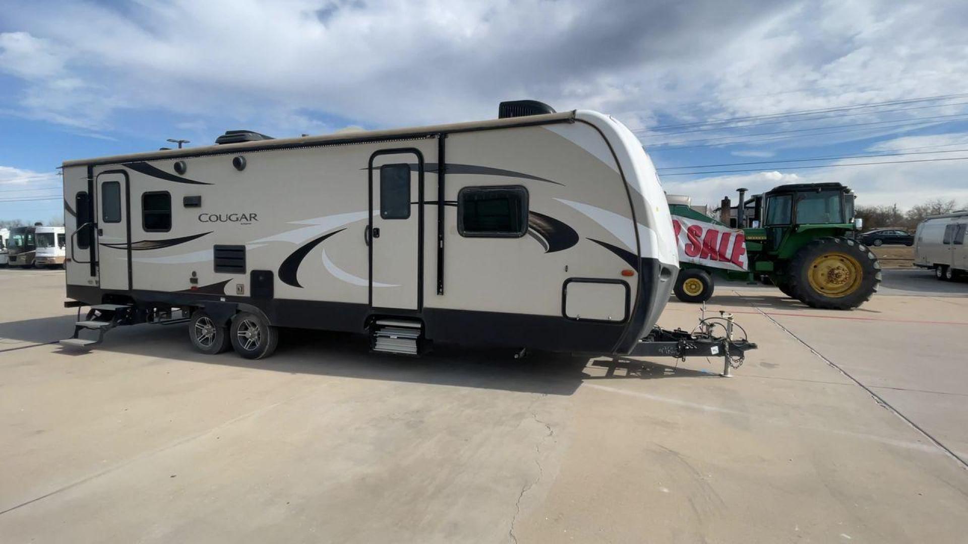 2019 TAN KEYSTONE COUGAR 29RLD (4YDT29R22JV) , Length: 34 ft. | Dry Weight: 7,380 lbs. | Gross Weight: 9,560 lbs. | Slides: 2 transmission, located at 4319 N Main St, Cleburne, TX, 76033, (817) 678-5133, 32.385960, -97.391212 - The 2019 Keystone Cougar 29RLD is a dual-axle aluminum wheel set-up measuring exactly 34 ft. in length. It has a dry weight of 7,380 lbs. and a GVWR of 9,560 lbs. Its exterior is a base color of tan with black and white accents. It comes with automatic heating and cooling rated at 35,000 and 15,000 - Photo#3