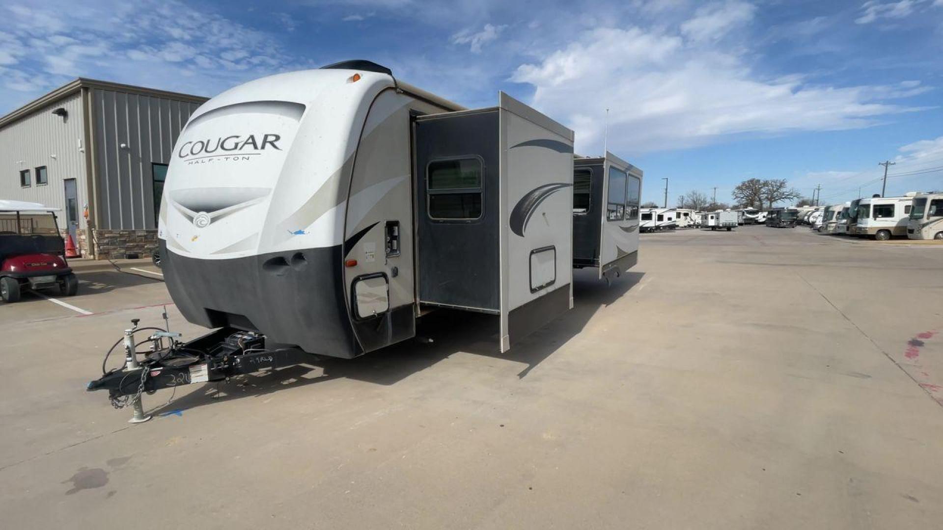 2019 TAN KEYSTONE COUGAR 29RLD (4YDT29R22JV) , Length: 34 ft. | Dry Weight: 7,380 lbs. | Gross Weight: 9,560 lbs. | Slides: 2 transmission, located at 4319 N Main St, Cleburne, TX, 76033, (817) 678-5133, 32.385960, -97.391212 - The 2019 Keystone Cougar 29RLD is a dual-axle aluminum wheel set-up measuring exactly 34 ft. in length. It has a dry weight of 7,380 lbs. and a GVWR of 9,560 lbs. Its exterior is a base color of tan with black and white accents. It comes with automatic heating and cooling rated at 35,000 and 15,000 - Photo#5