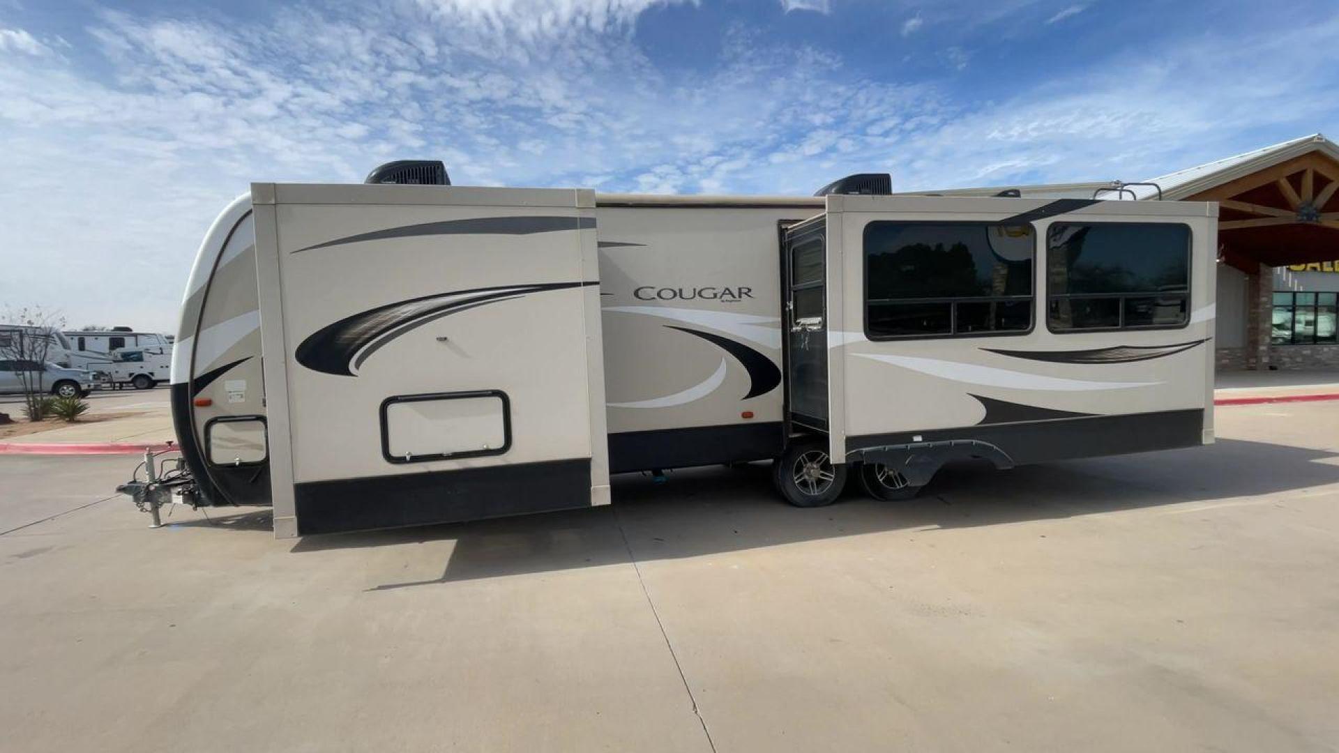 2019 TAN KEYSTONE COUGAR 29RLD (4YDT29R22JV) , Length: 34 ft. | Dry Weight: 7,380 lbs. | Gross Weight: 9,560 lbs. | Slides: 2 transmission, located at 4319 N Main St, Cleburne, TX, 76033, (817) 678-5133, 32.385960, -97.391212 - The 2019 Keystone Cougar 29RLD is a dual-axle aluminum wheel set-up measuring exactly 34 ft. in length. It has a dry weight of 7,380 lbs. and a GVWR of 9,560 lbs. Its exterior is a base color of tan with black and white accents. It comes with automatic heating and cooling rated at 35,000 and 15,000 - Photo#6