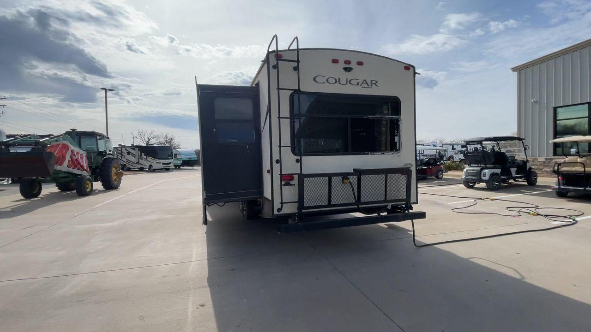 2019 TAN KEYSTONE COUGAR 29RLD (4YDT29R22JV) , Length: 34 ft. | Dry Weight: 7,380 lbs. | Gross Weight: 9,560 lbs. | Slides: 2 transmission, located at 4319 N Main St, Cleburne, TX, 76033, (817) 678-5133, 32.385960, -97.391212 - The 2019 Keystone Cougar 29RLD is a dual-axle aluminum wheel set-up measuring exactly 34 ft. in length. It has a dry weight of 7,380 lbs. and a GVWR of 9,560 lbs. Its exterior is a base color of tan with black and white accents. It comes with automatic heating and cooling rated at 35,000 and 15,000 - Photo#8