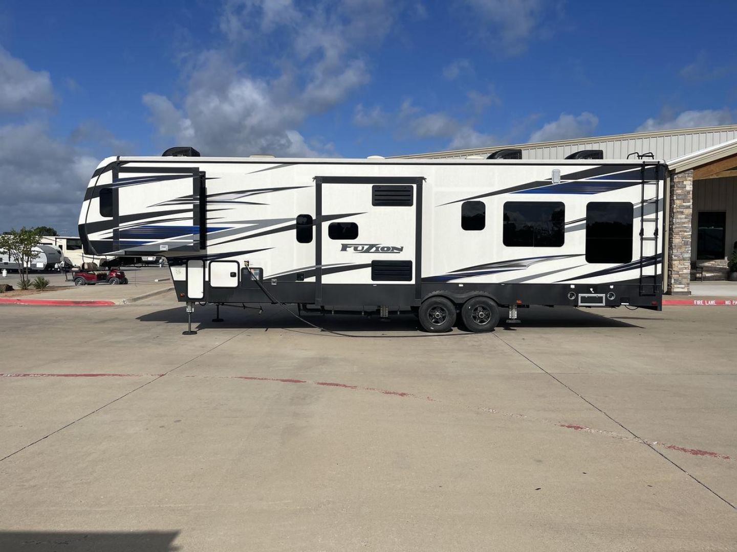 2019 KEYSTONE FUZION 373 (4YDF37322KF) , Length: 39 ft. | Dry Weight: 13,920 lbs. | Gross Weight: 17,000 lbs. | Slides: 3 transmission, located at 4319 N Main St, Cleburne, TX, 76033, (817) 678-5133, 32.385960, -97.391212 - The 2019 Keystone Fuzion 373 is an impressive 39-foot toy hauler designed for adventurous travelers. With a dry weight of 13,920 lbs and a gross weight of 17,000 lbs, this RV combines rugged capabilities with luxurious living spaces. Featuring three slides, the Fuzion 373 offers a spacious interior - Photo#24