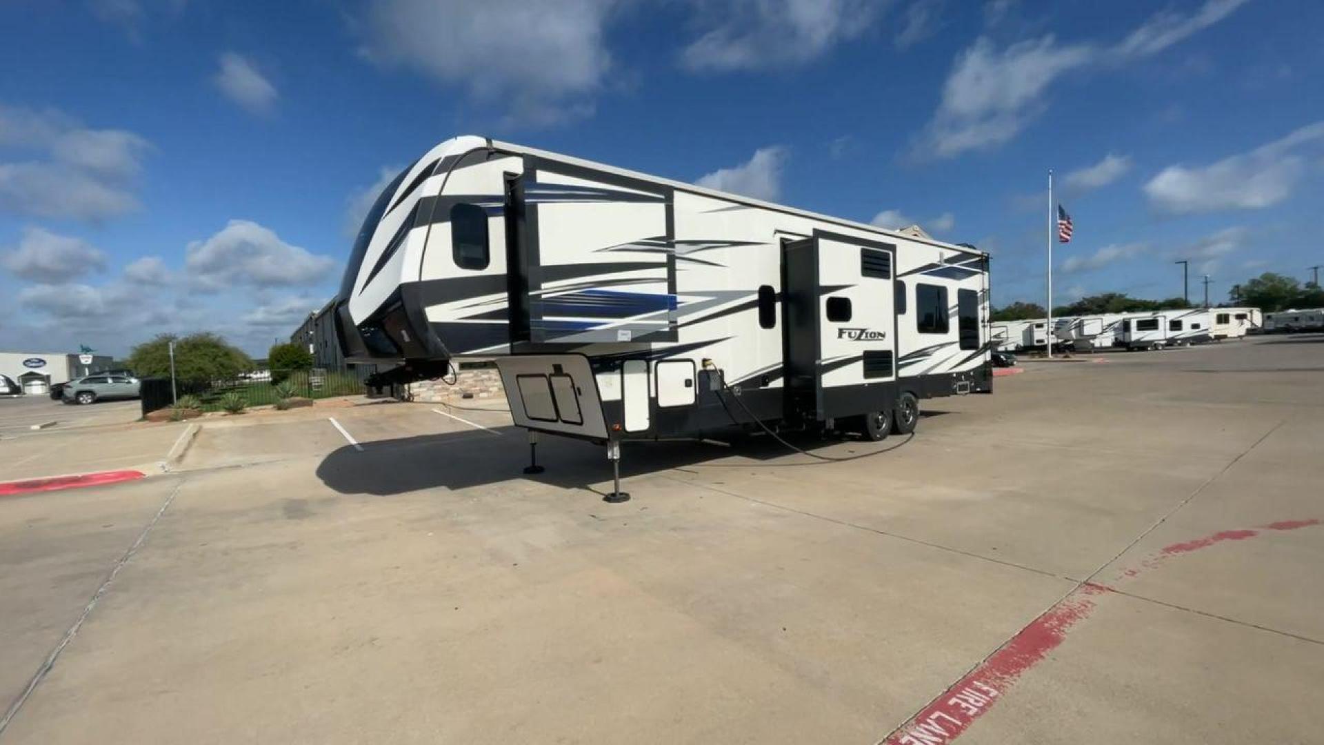 2019 KEYSTONE FUZION 373 (4YDF37322KF) , Length: 39 ft. | Dry Weight: 13,920 lbs. | Gross Weight: 17,000 lbs. | Slides: 3 transmission, located at 4319 N Main St, Cleburne, TX, 76033, (817) 678-5133, 32.385960, -97.391212 - The 2019 Keystone Fuzion 373 is an impressive 39-foot toy hauler designed for adventurous travelers. With a dry weight of 13,920 lbs and a gross weight of 17,000 lbs, this RV combines rugged capabilities with luxurious living spaces. Featuring three slides, the Fuzion 373 offers a spacious interior - Photo#5