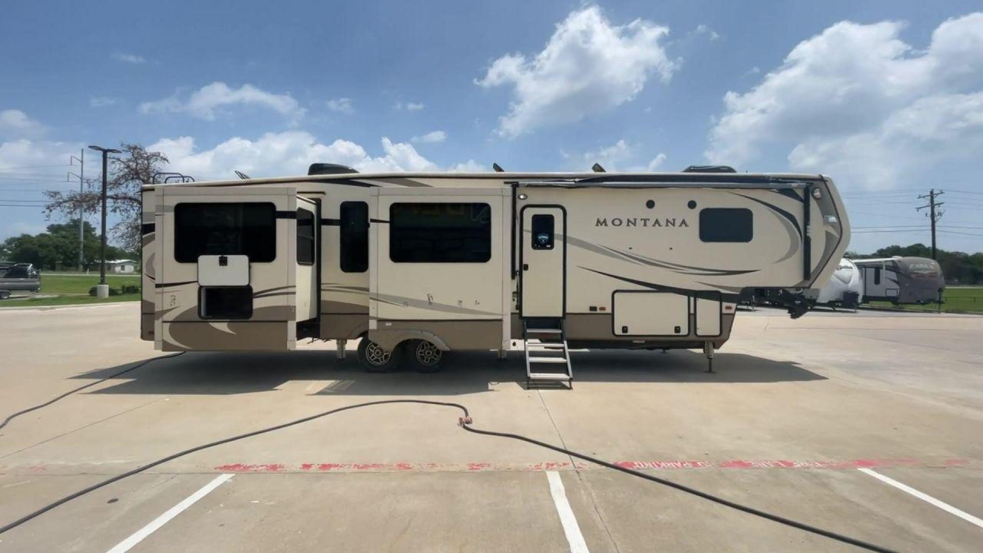 2019 KEYSTONE MONTANA 3701LK (4YDF3702XK4) , Length: 40.5 ft. | Dry Weight: 13,095 lbs. | Gross Weight: 16,400 lbs. | Slides: 4 transmission, located at 4319 N Main St, Cleburne, TX, 76033, (817) 678-5133, 32.385960, -97.391212 - Looking to camp in the lap of luxury and comfort? Go for this 2019 Keystone Montana 3701LK! This fifth wheel measures 40.5 ft. in length and 13.42 ft. in height. Not only is it spacious, but it also has plenty of headroom for tall campers! It also has a dry weight of 13,095 lbs. with a 3,305-poun - Photo#2