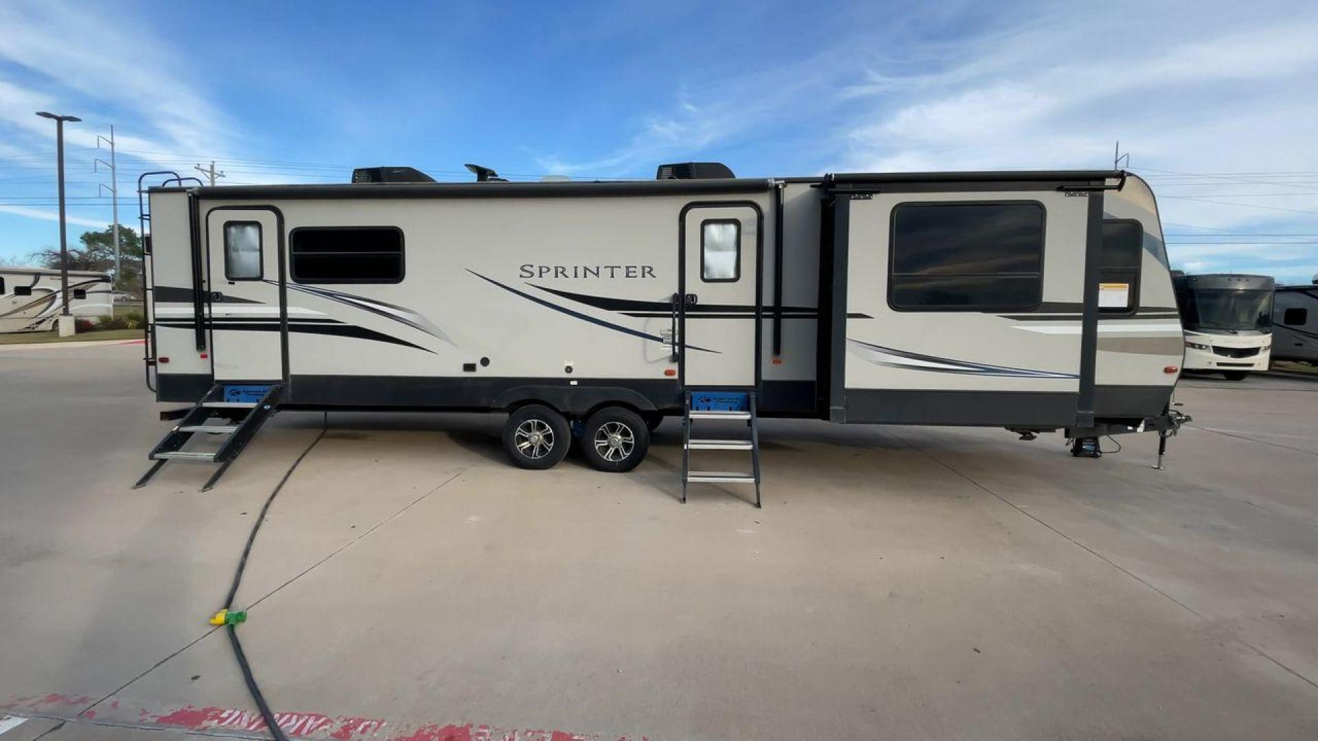 2019 KEYSTONE SPRINTER 330KBS (4YDT33021K1) , Length: 37.75 ft. | Dry Weight: 9,100 lbs. | Gross Weight: 11,500 lbs. | Slides: 3 transmission, located at 4319 N Main St, Cleburne, TX, 76033, (817) 678-5133, 32.385960, -97.391212 - The 2019 Keystone Sprinter 330KBS travel trailer is a spacious and well-designed unit, measuring 37.75 feet in length. The exterior is sleek and modern, featuring a gray and white color scheme accented by black and blue graphic lines. The trailer has three (3) slideouts, providing ample space for c - Photo#2