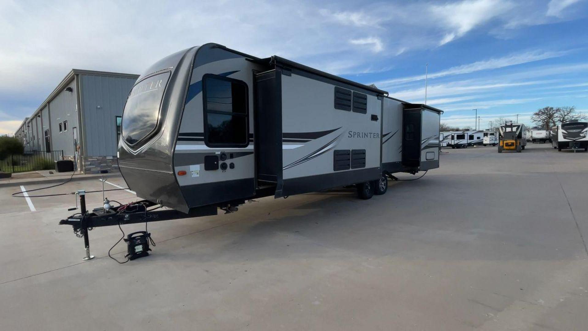 2019 KEYSTONE SPRINTER 330KBS (4YDT33021K1) , Length: 37.75 ft. | Dry Weight: 9,100 lbs. | Gross Weight: 11,500 lbs. | Slides: 3 transmission, located at 4319 N Main St, Cleburne, TX, 76033, (817) 678-5133, 32.385960, -97.391212 - The 2019 Keystone Sprinter 330KBS travel trailer is a spacious and well-designed unit, measuring 37.75 feet in length. The exterior is sleek and modern, featuring a gray and white color scheme accented by black and blue graphic lines. The trailer has three (3) slideouts, providing ample space for c - Photo#5