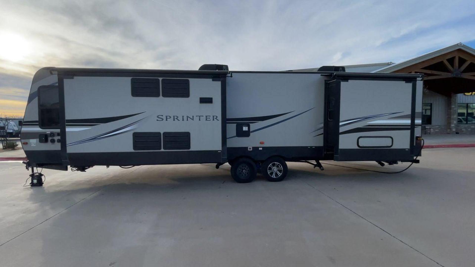 2019 KEYSTONE SPRINTER 330KBS (4YDT33021K1) , Length: 37.75 ft. | Dry Weight: 9,100 lbs. | Gross Weight: 11,500 lbs. | Slides: 3 transmission, located at 4319 N Main St, Cleburne, TX, 76033, (817) 678-5133, 32.385960, -97.391212 - The 2019 Keystone Sprinter 330KBS travel trailer is a spacious and well-designed unit, measuring 37.75 feet in length. The exterior is sleek and modern, featuring a gray and white color scheme accented by black and blue graphic lines. The trailer has three (3) slideouts, providing ample space for c - Photo#6