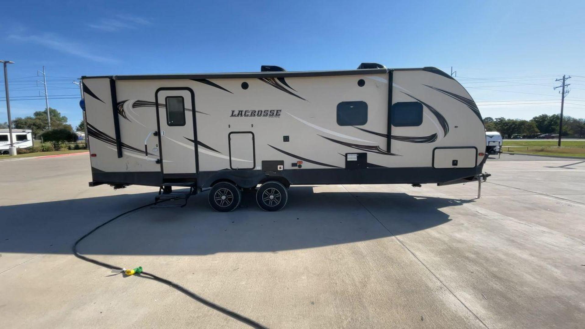 2019 TAN PRIME TIME LACROSSE 2911RB - (5ZT2LCUB3KB) , Length: 31.92 ft. | Dry Weight: 6,516 lbs. | Slides: 1 transmission, located at 4319 N Main St, Cleburne, TX, 76033, (817) 678-5133, 32.385960, -97.391212 - This 2019 LaCrosse 2911RB travel trailer measures just a bit under 32' in length. It is a dual axle, aluminum wheel setup with a dry weight of 6,516 lbs and has a carrying capacity of 3,054 lbs. This LaCrosse has one slide. The rear of the trailer holds the bathroom, which has a standalone sink a - Photo#2