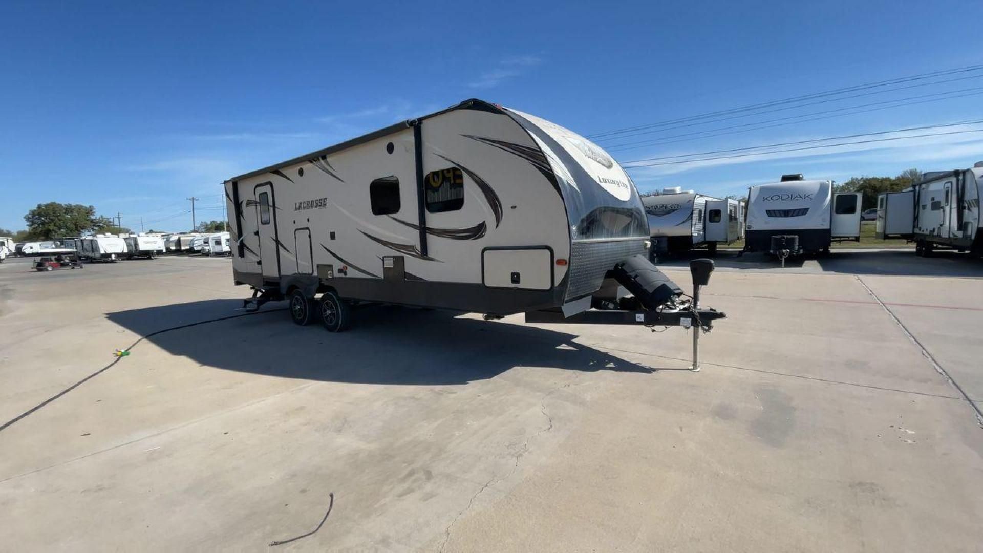 2019 TAN PRIME TIME LACROSSE 2911RB - (5ZT2LCUB3KB) , Length: 31.92 ft. | Dry Weight: 6,516 lbs. | Slides: 1 transmission, located at 4319 N Main St, Cleburne, TX, 76033, (817) 678-5133, 32.385960, -97.391212 - This 2019 LaCrosse 2911RB travel trailer measures just a bit under 32' in length. It is a dual axle, aluminum wheel setup with a dry weight of 6,516 lbs and has a carrying capacity of 3,054 lbs. This LaCrosse has one slide. The rear of the trailer holds the bathroom, which has a standalone sink and - Photo#3